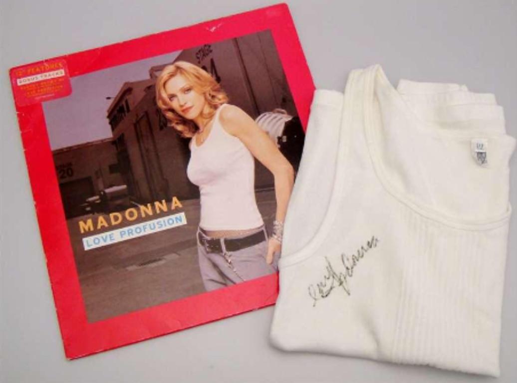- GAP tank top worn by Madonna on the cover of single Love Profusion (2003)

- Bold, clear autograph from Madonna

- Fantastic display piece

Madonna (1958-) is a globally-successful singer, toppling the music charts internationally since the