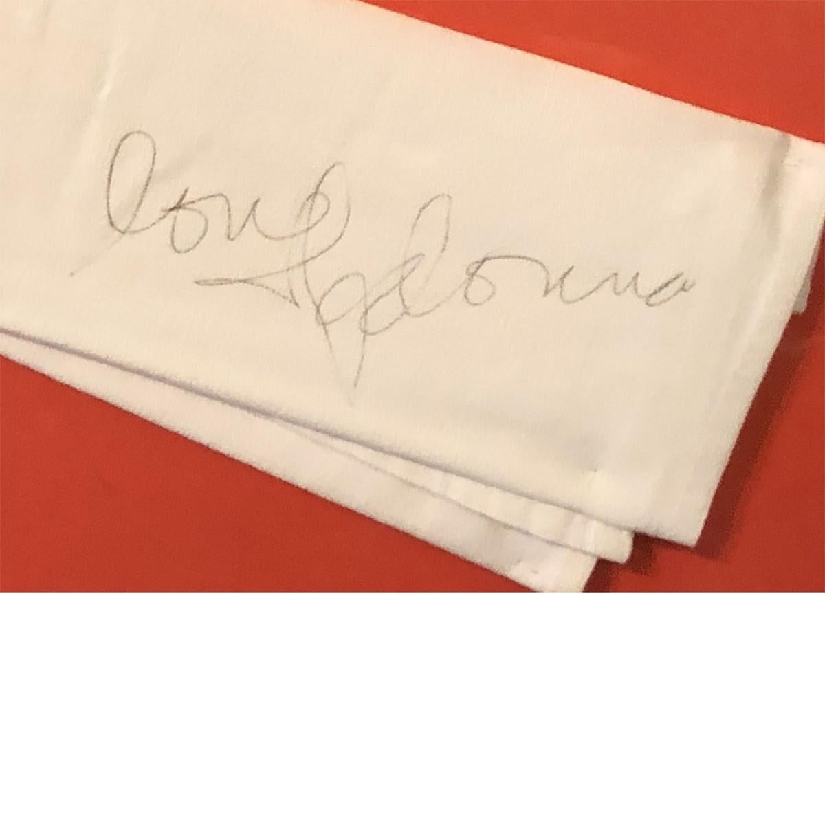 Measures: 12.5 H x 14.5 W x D inches
This is an authentic napkin was signed by Madonna. Subtle and clean lines as opposed to the Stark lines of the modern era. This autographed white cloth napkin was signed by Madonna and framed in a black frame