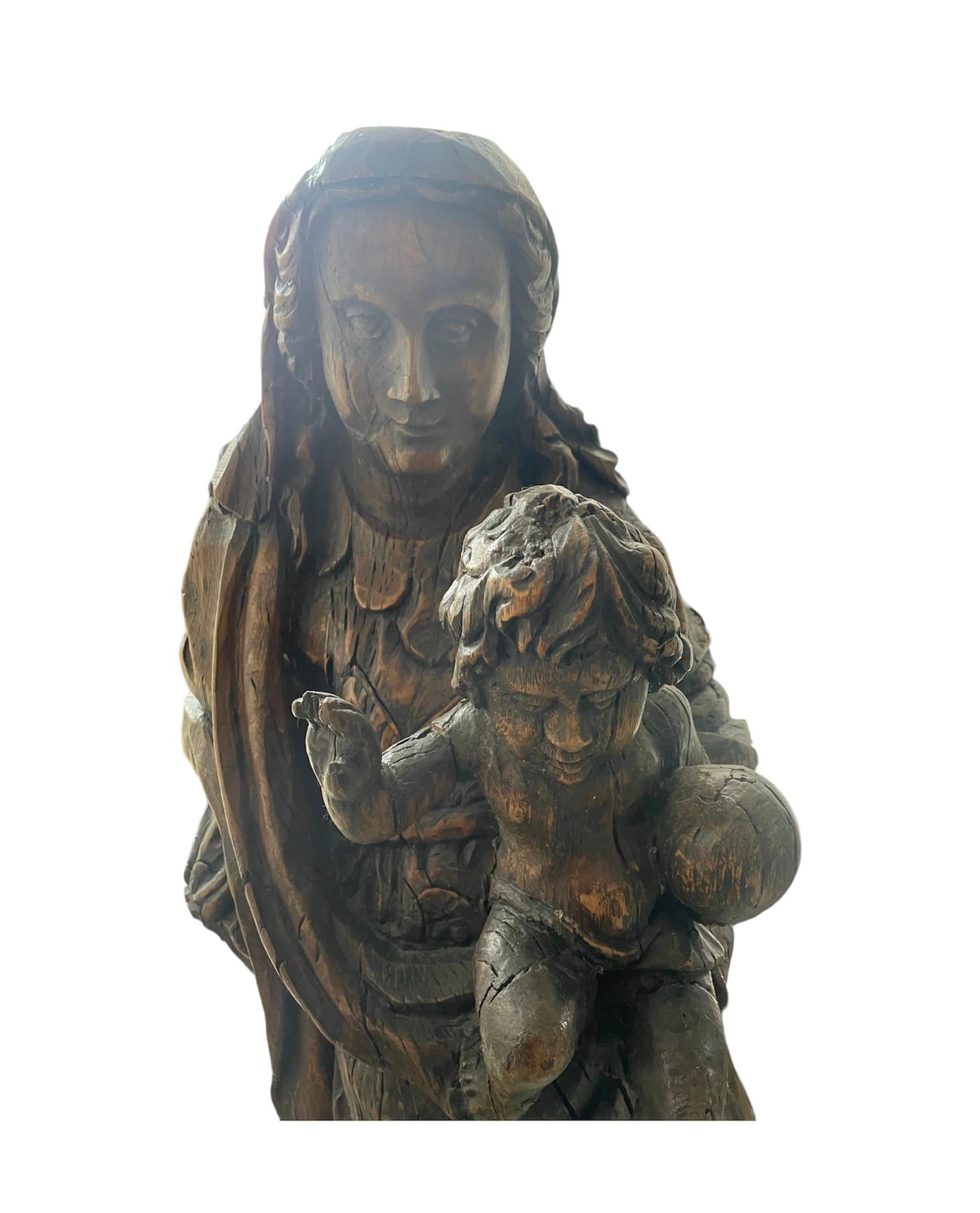 Beautiful piece of a mother with her child, excellent handmade work on wood, made in the eighteenth century in Puebla, Mexico.