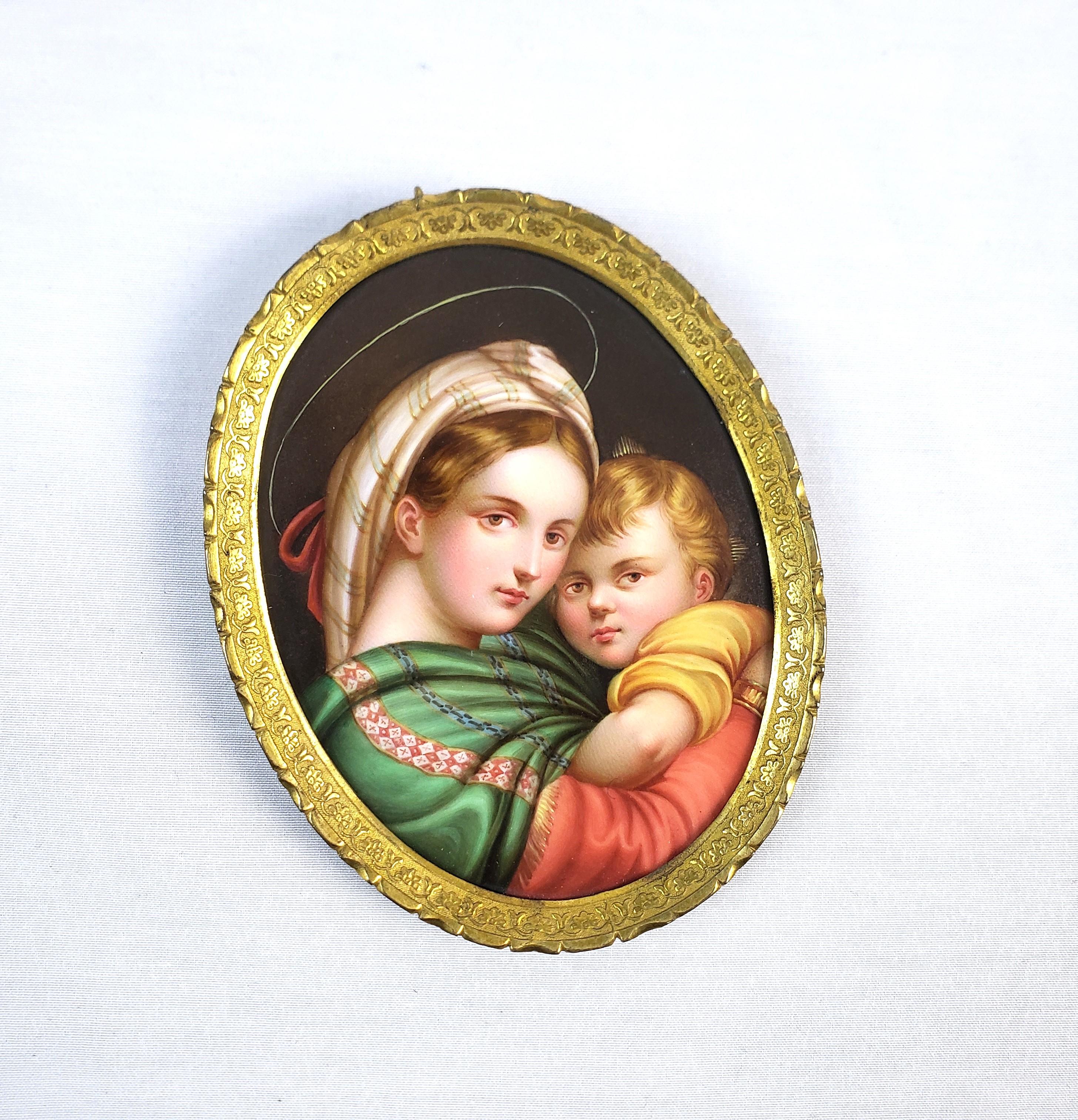 This finely executed portrait is unsigned and presumed to have originated from Italy and date to approximately 1900 and done in a Renaissance style. The portrait is hand-painted on a porcealin medallion and depicts the iconic image of the Madonna de