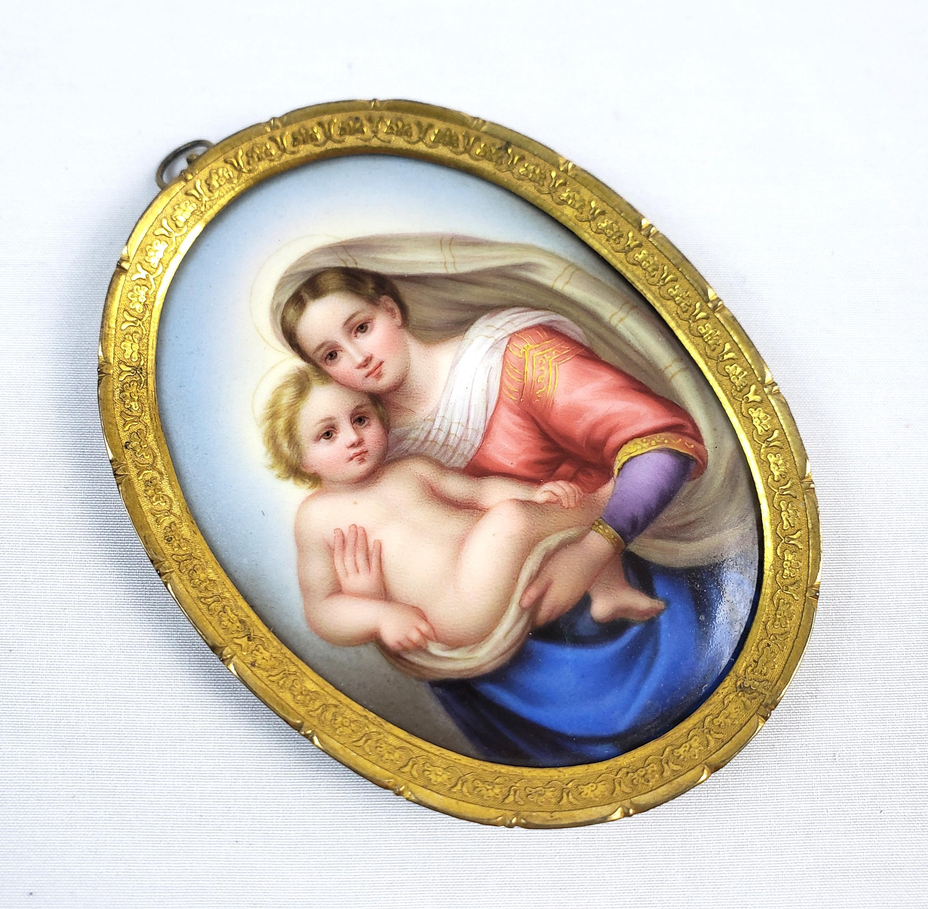 This finely executed portrait is unsigned and presumed to have originated from Italy and date to approximately 1900 and done in a Renaissance style. The portrait is hand-painted on a porcealin medallion and depicts the iconic image of the Madonna