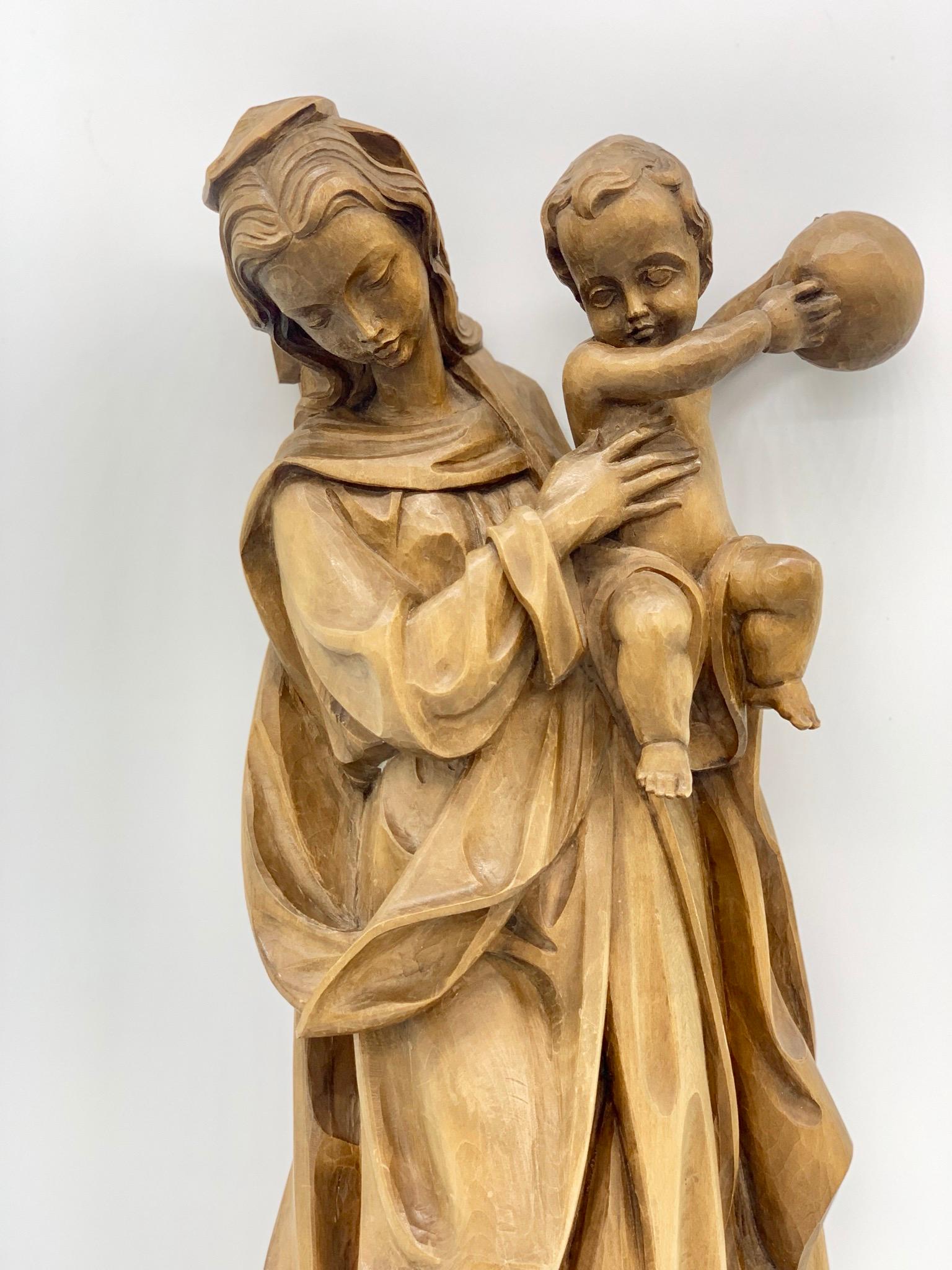 Madonna with child wall sculpture beautiful woodwork, 20th century. Linden wood with attention to detail.
