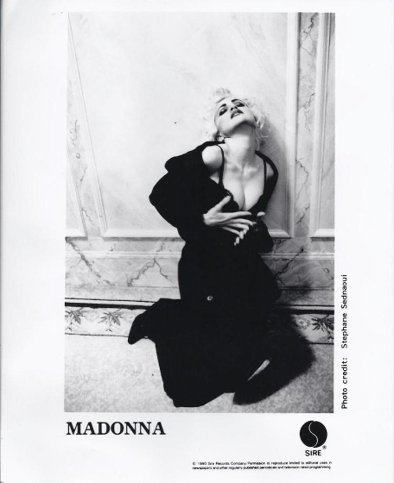  - A black underslip worn by Madonna in a 1990 photoshoot for a promotional photo

This black satin underslip with adjustable shoulder straps was owned and worn by Madonna as seen and used on Sire Records' 1990 promotional photo, a 10 x 8 of which