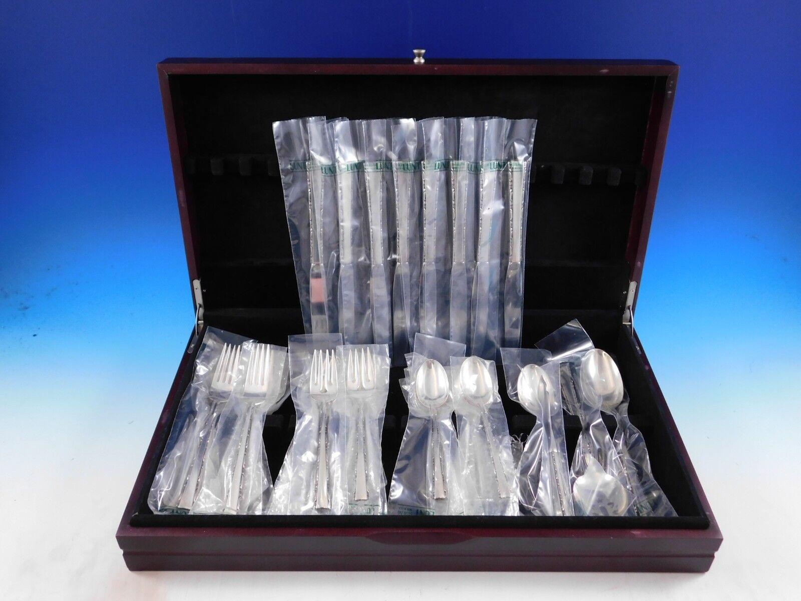 New, unused Madrigal by Lunt Sterling Silver Flatware set - 36 pieces. This set includes:

8 Knives, 9