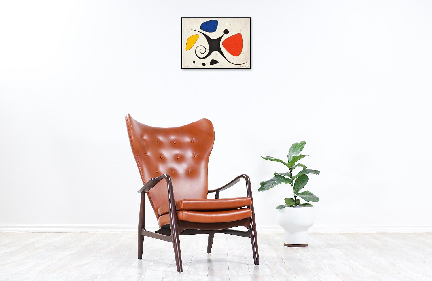 Exceptional wingback lounge chair designed by Danish duo designers Henry Schubell and Arnold Madsen in collaboration with the workshop of Vik & Blindheim during the 1950s. This rare sculpted chair features a solid walnut-stained beech wood frame