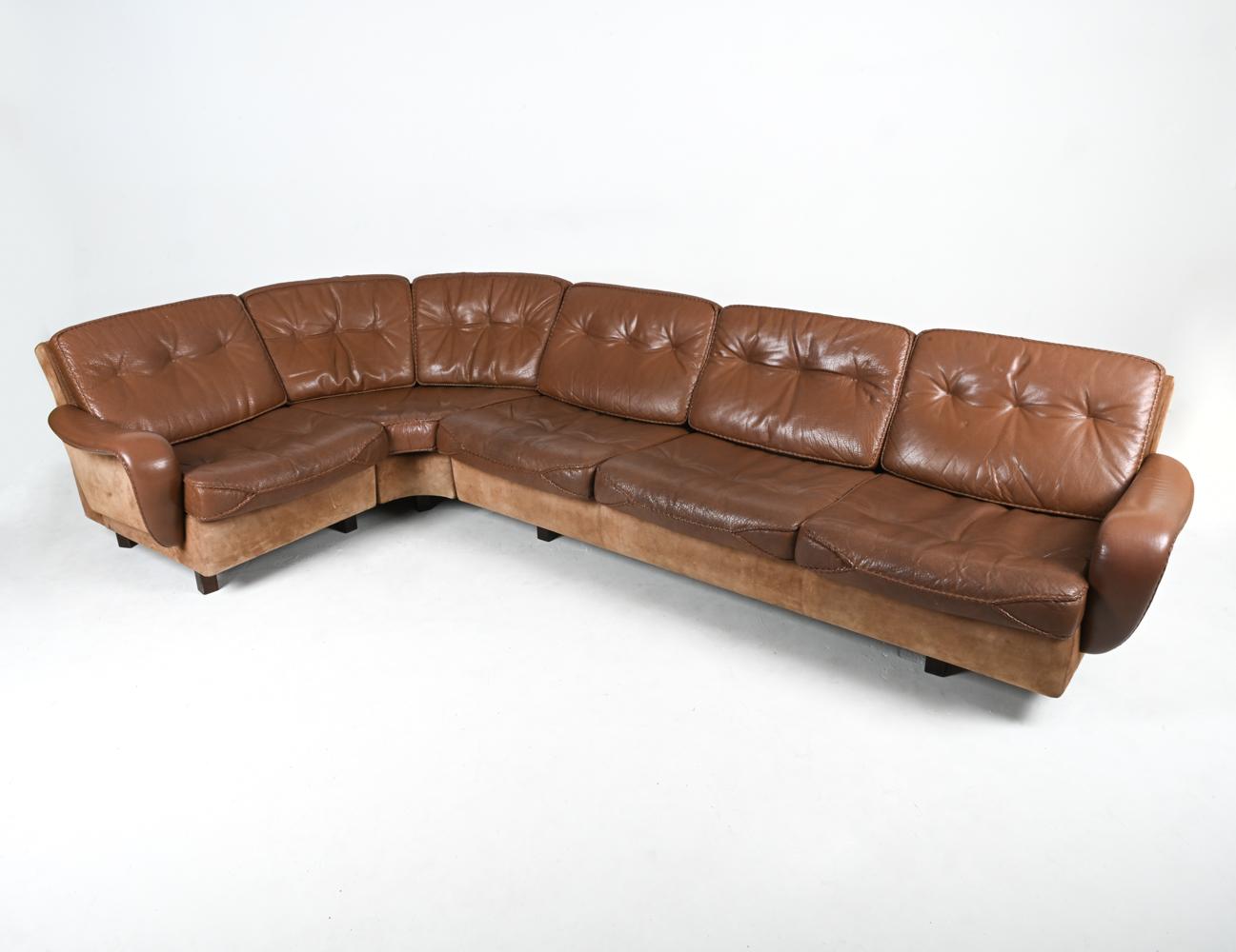 Furnish the ultimate Scandinavian Modern lounge with this rare sectional sofa by the Danish design team of Ib Madsen and Acton Schubell. Finished in luxurious brown suede and buffalo leather for a subtle colorblocked look, this sofa features bold