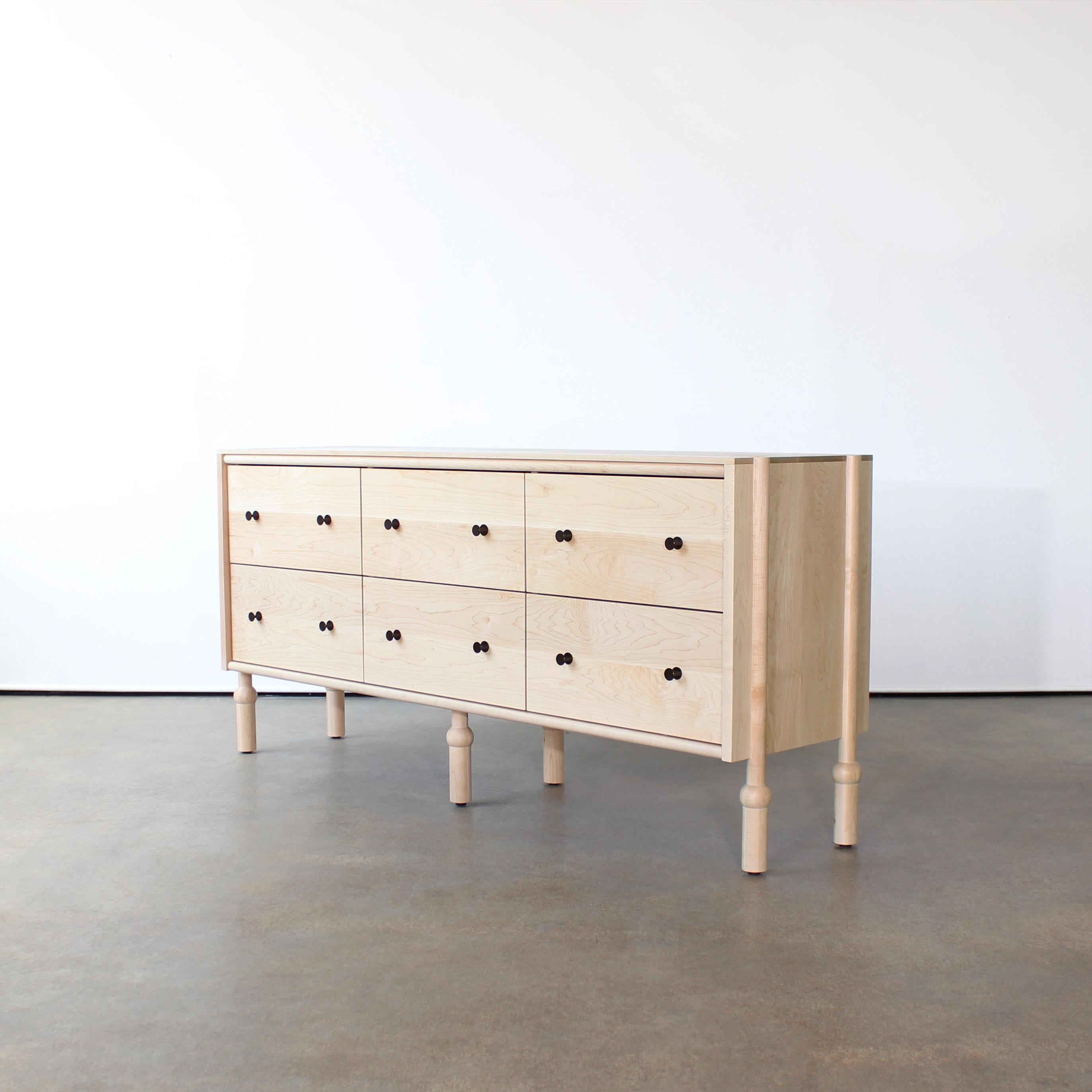 Mae dresser by Crump and Kwash.

Solid wood case / hand turned legs / hand rubbed oil finish / solid brass pulls / premium, full extension, soft close drawer slides / solid wood, dovetailed drawer boxes

Customizations available.