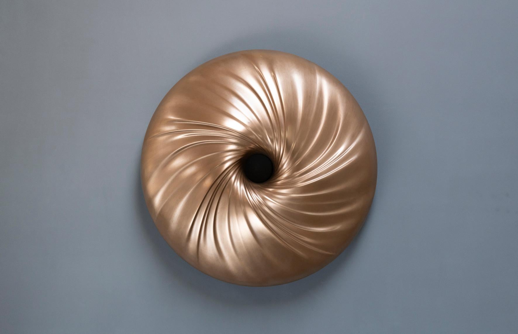 This limited edition of twelve wall mounted bronze sculptures is inspired by a fascinating natural phenomenon. In a maelstrom, hidden forces are in play in an alluring dance choreographed by the power of Mother Nature. The calmness at the smooth