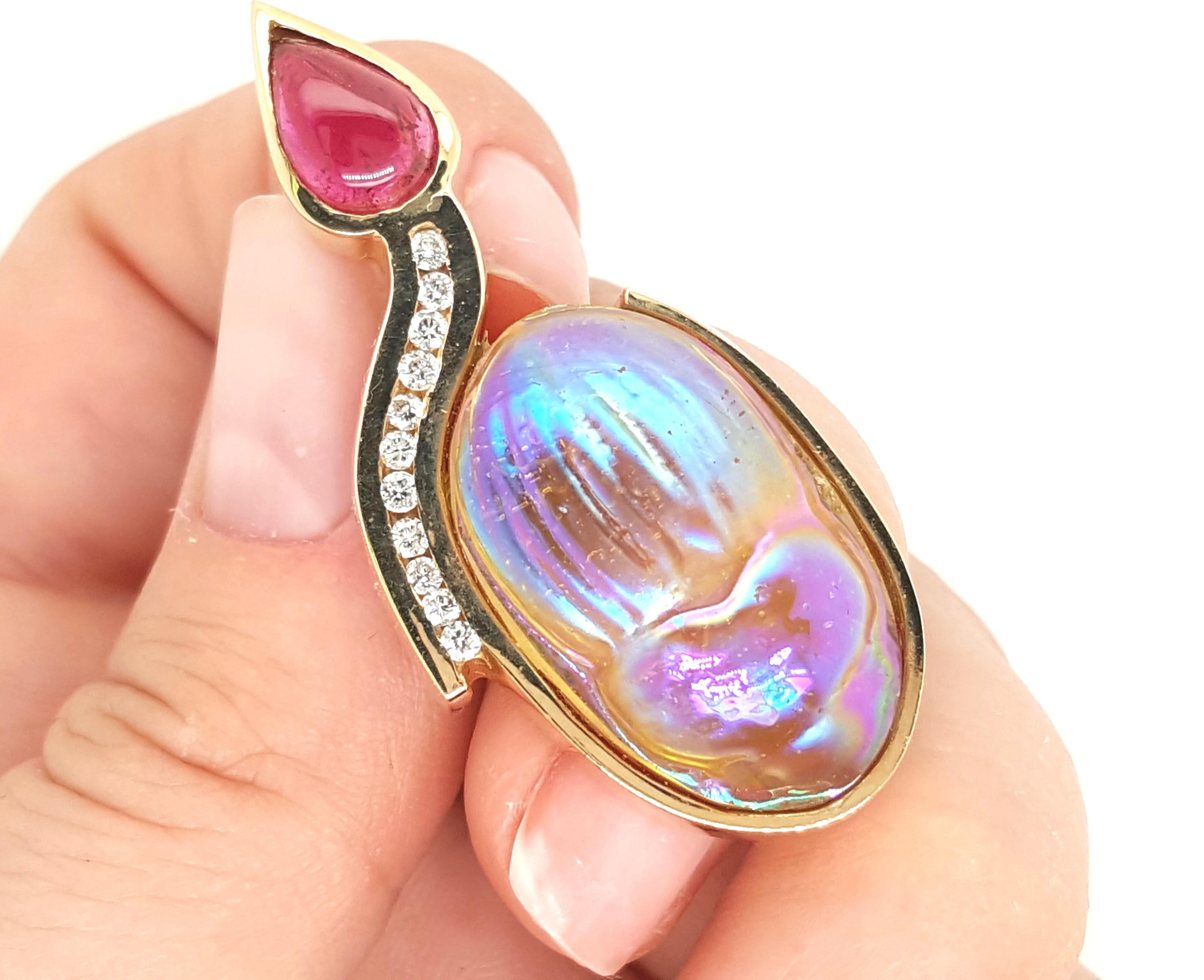 Contemporary Style 14K Yellow Gold Pink Tourmaline and Diamond Brooch.  This impressive brooch features a scarab, bezel set and accented by a pink pear shaped cabochon tourmaline and enhanced by channel set round brilliant cut diamonds. In Egypt the