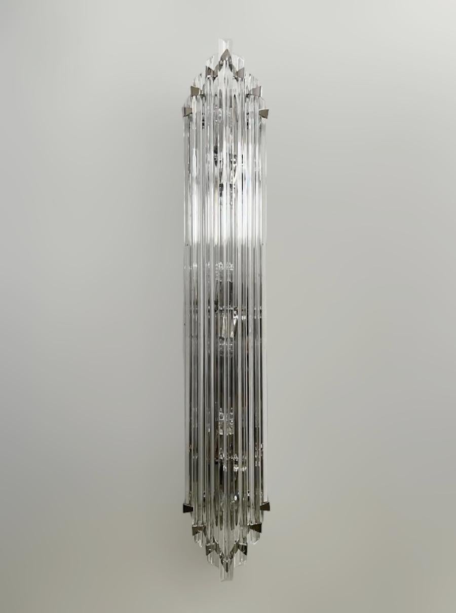Italian wall light with clear hand blown crystals cut to three points in Triedri technique, mounted on back plate and hardware in polished nickel finish / Designed by Fabio Bergomi for Fabio Ltd / Made in Italy.
6 lights / E12 or E14 type / max 40W