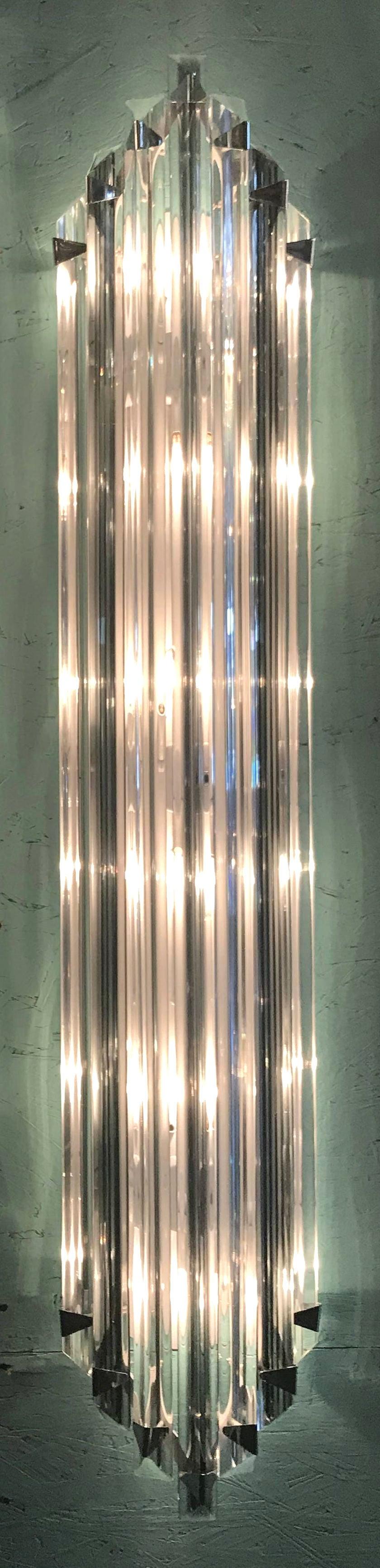 Italian wall light with clear crystals individually hand blown with smoky stripes and cut to three points in Triedri technique, mounted on chrome hardware and white metal back plate / Designed by Fabio Bergomi for Fabio Ltd / Made in Italy.
6 lights