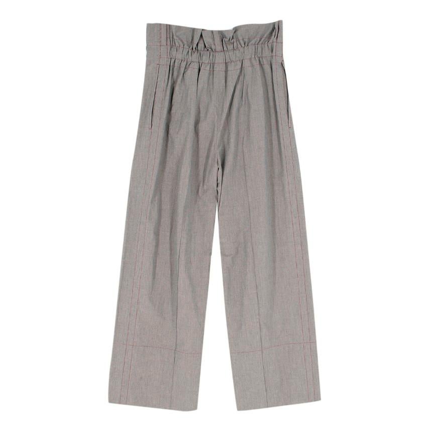 Mafalda Von Hessen Grey Paper Bag Trousers

- Matching jacket available 
-Grey wide leg trousers 
-Pleated front trousers
-Ruching at the back waistband
-Red contrast stitching
-Zip and button closure
-Two front pockets

Please note, these items are