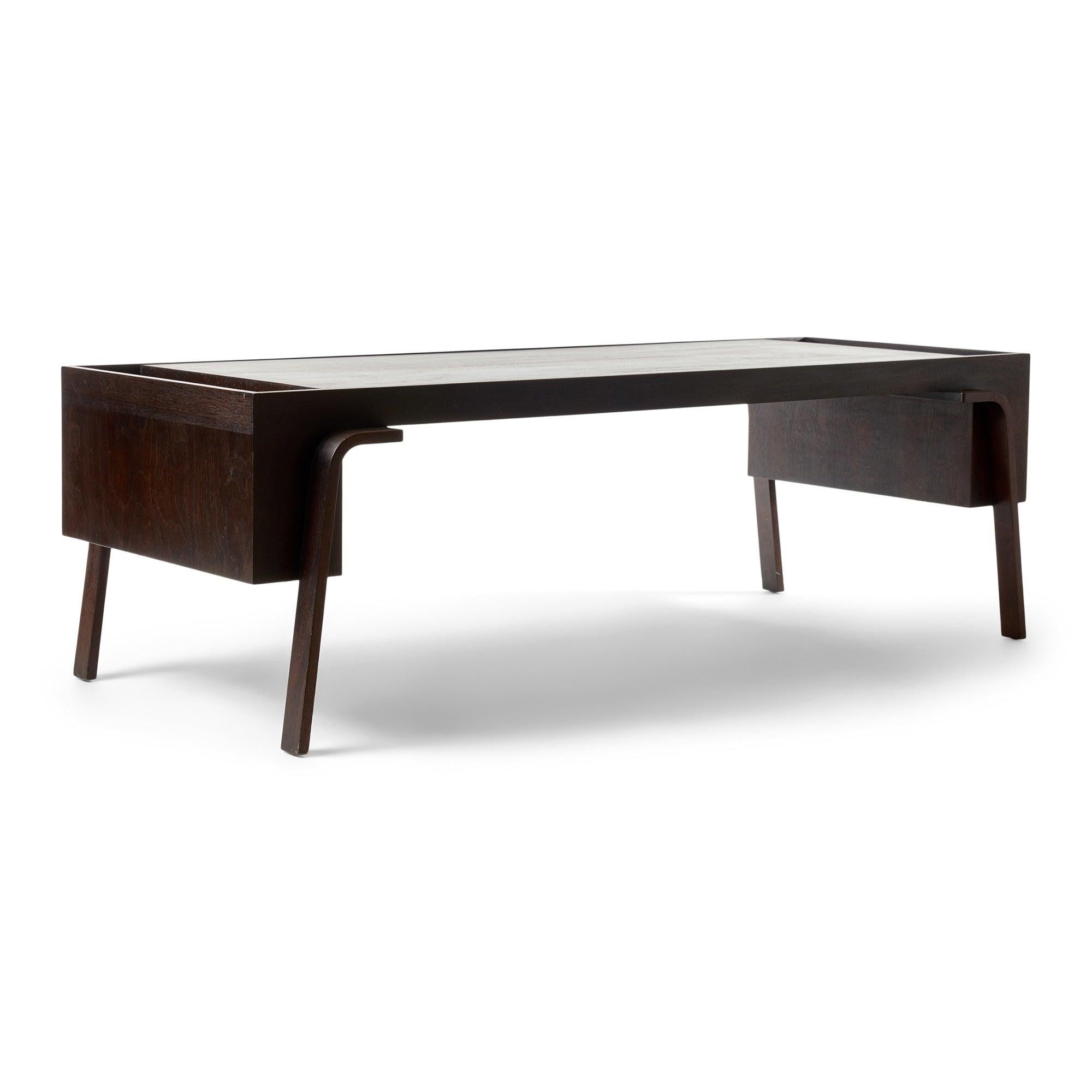 An ebonized mahogany low table with magazine boxes on the ends.