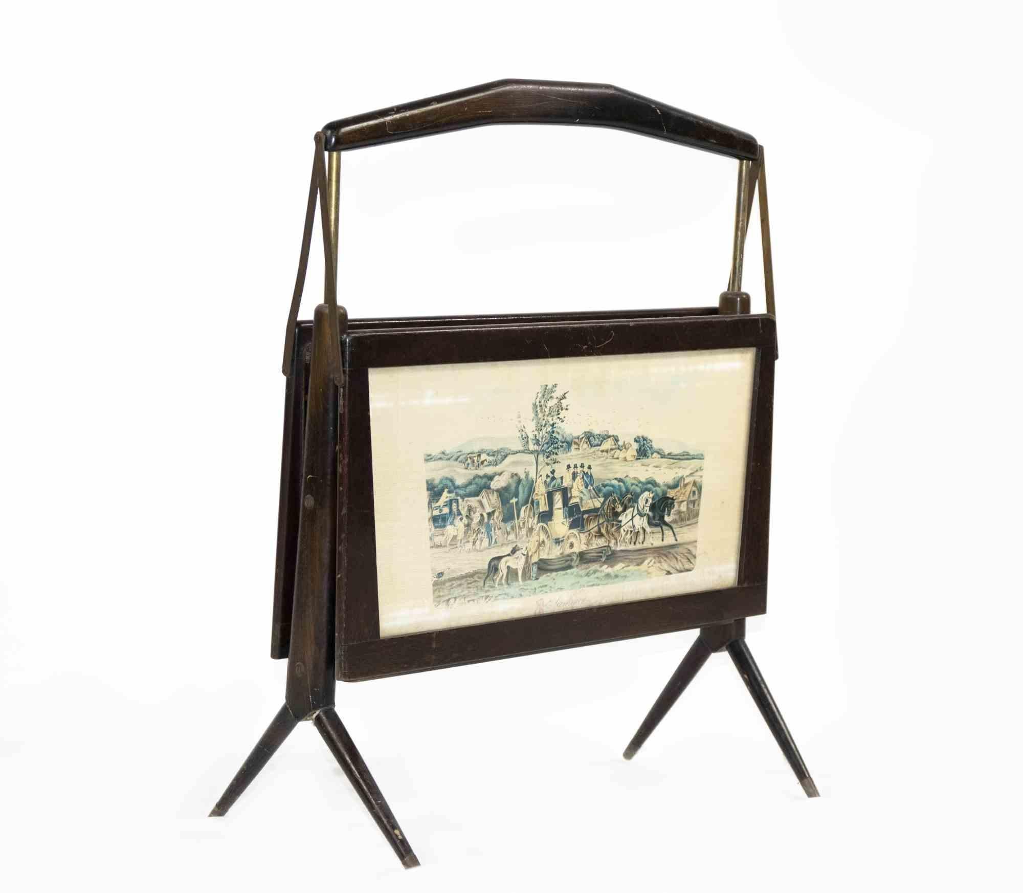 Magazine holder is an original design item realized by Ico Parisi in the half of 20th century.

A precoius wooden magazine holder decorated with two print on both sides.

Mint conditions (skretches and one leg worn out.).