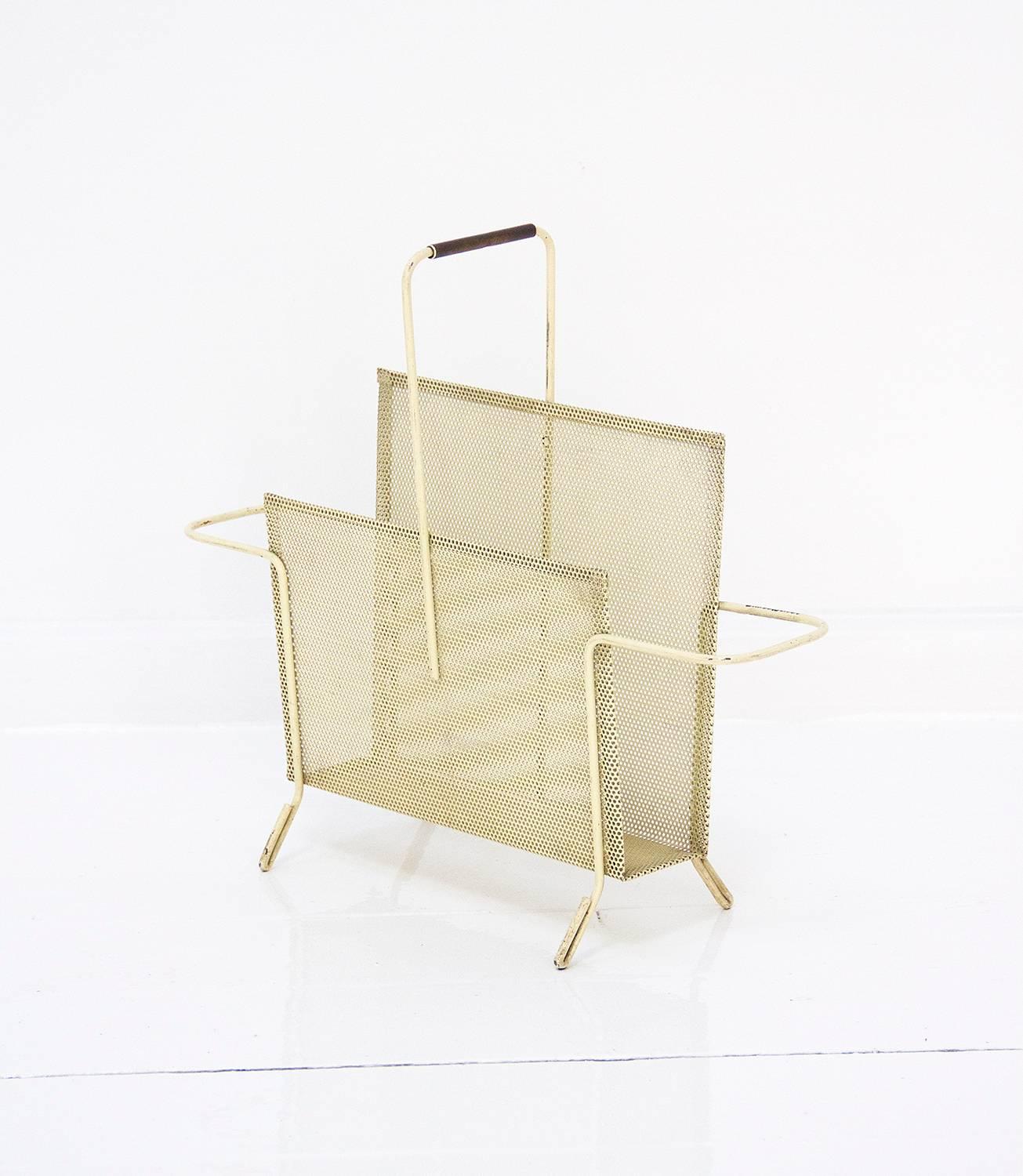 Magazine holder designed by Mathieu Matégot and manufactured by Ateliers Matégot in France. It is made of perforated folded metal in a very good original condition and preservating original patina,
circa 1950, France.

  