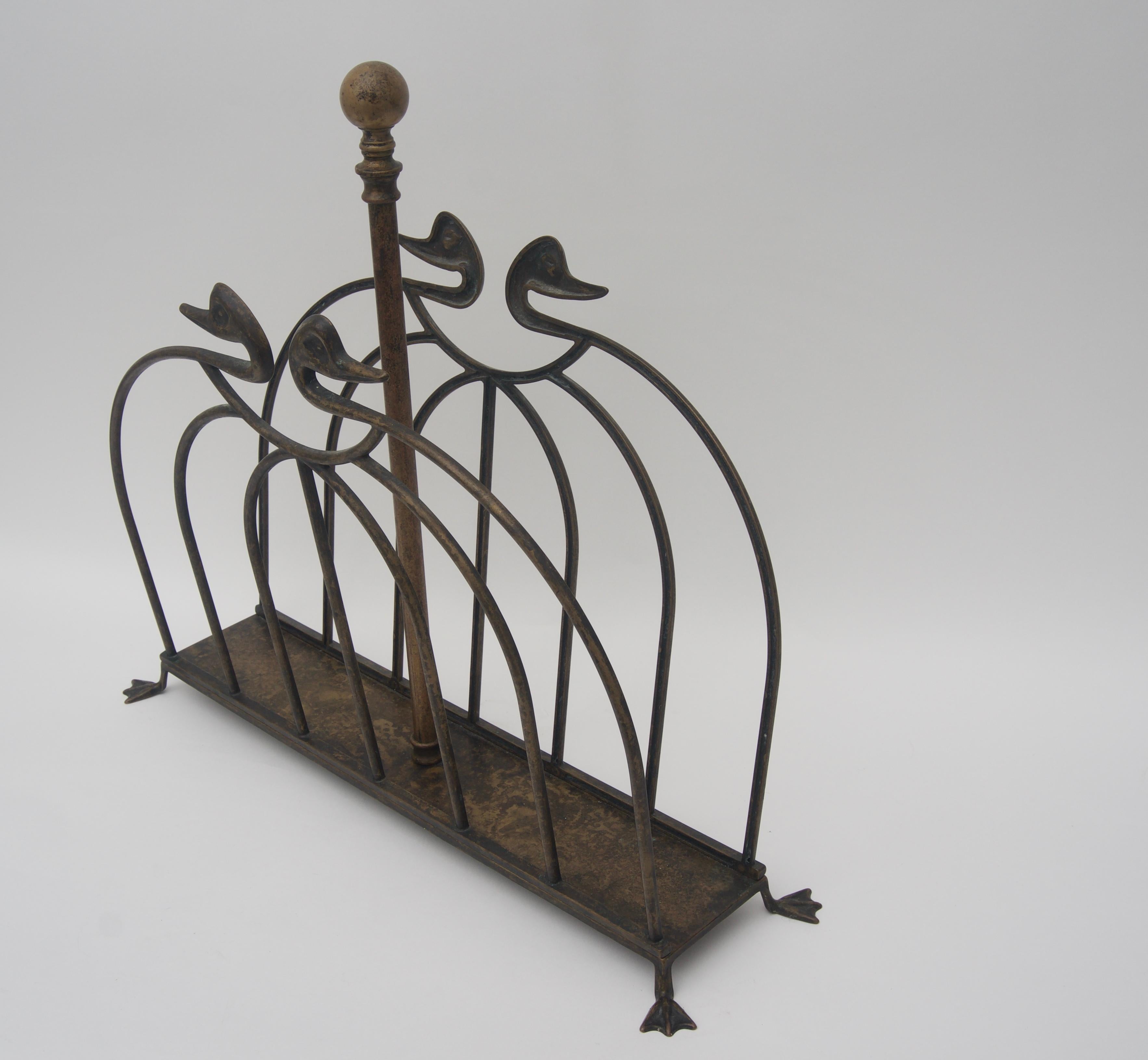 This stylish magazine holder is very much in the style and quality of pieces created by Maison Jansen and it dates to the 1960s. The piece is fabricated in bronze and retains an original made in Italy label on the underside.