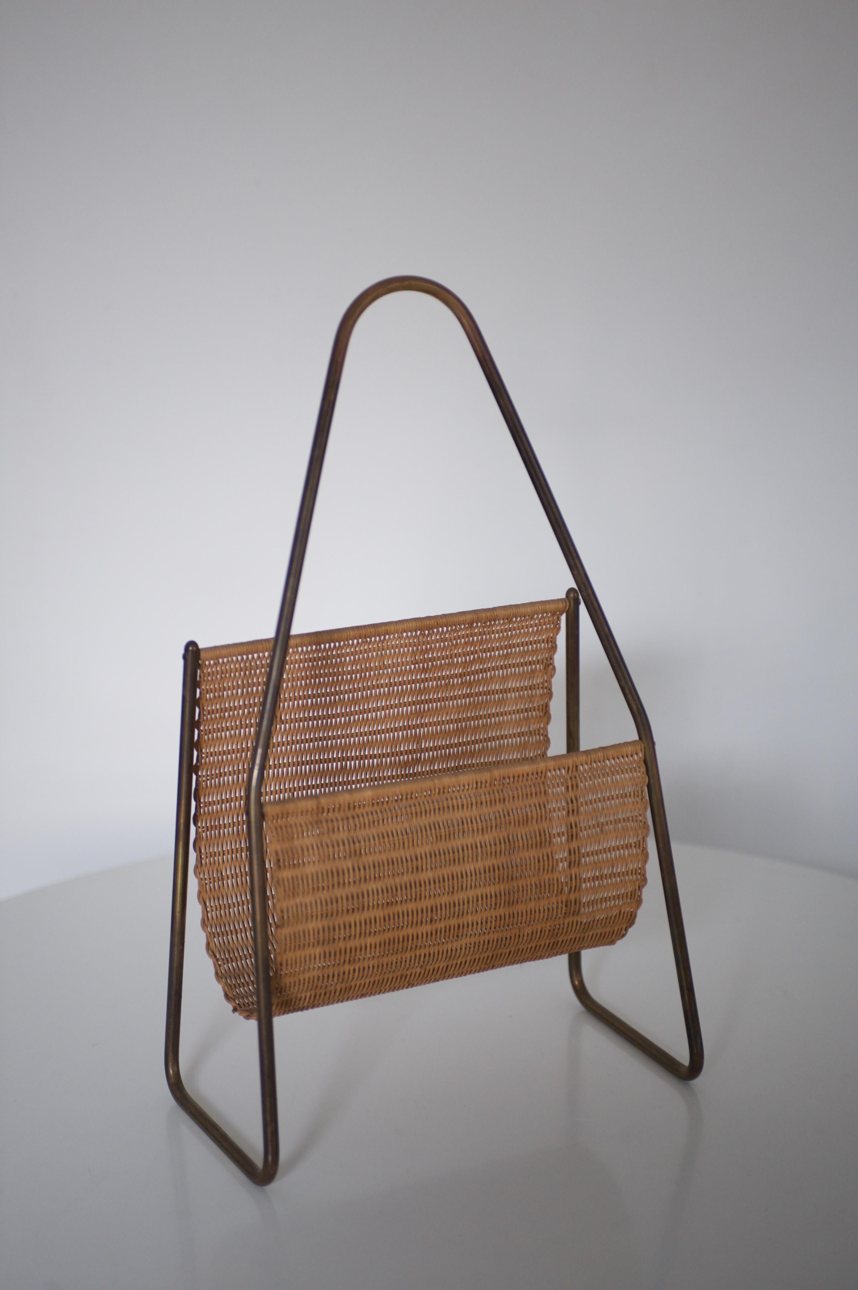 Magazine / Newspaper rack, no. 3808
1950 by Carl Auböck
brass frame and wicker work.

Measures: 15.5 x 31.5 cm, H 50 cm / 6.10 x 12.40 in, H 19.69 in.

Very good condition!

Literature: Clemens Kois; Carl Auböck - The Workshop, powerHouse