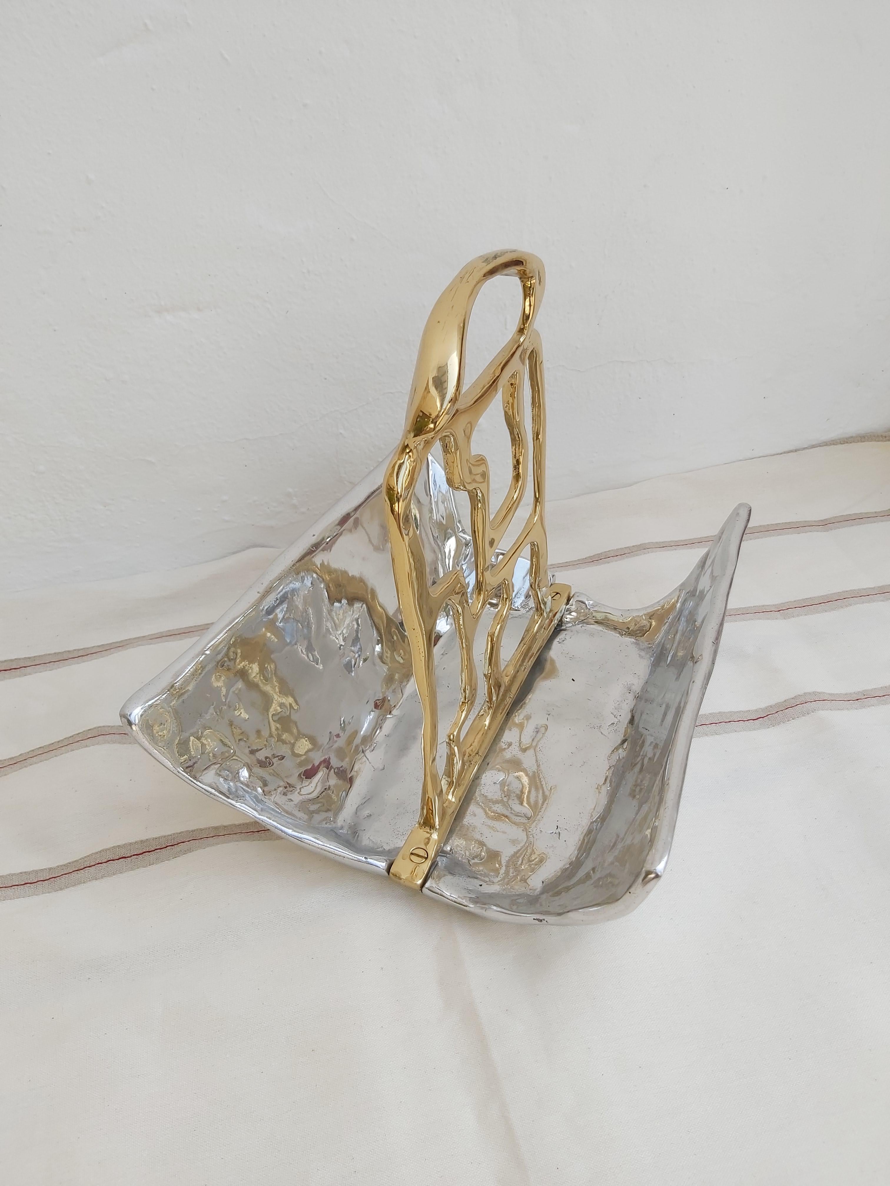 The decorative Magazine Rack was created by David Marshall, it is made of sand cast aluminum and sand cast brass.
Handmade, mounted and finished in our foundry and workshop in Spain from recycled materials.
Certified authentic by the Artist David