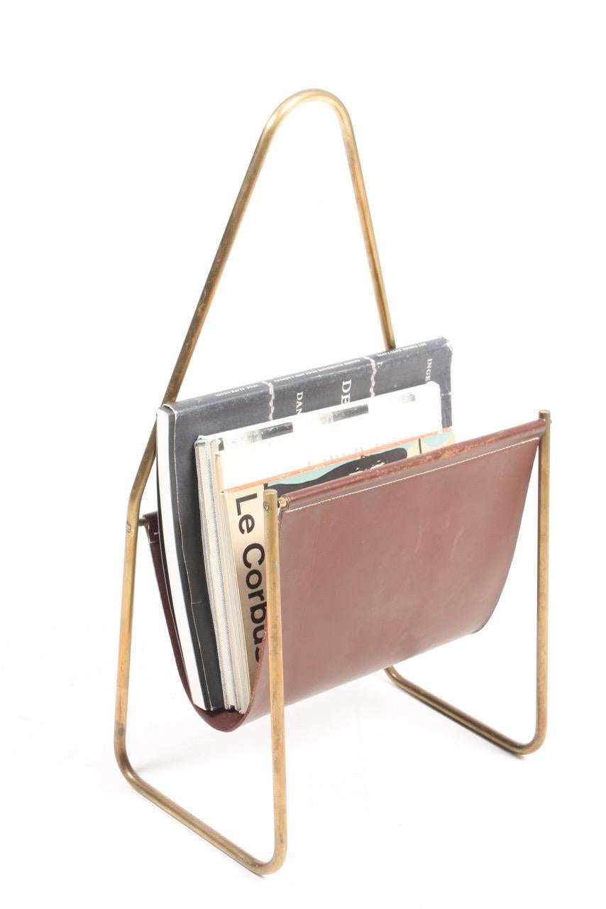 Magazine stand in brass and leather designed and made by Carl Auböck in the 1950s. Great condition.