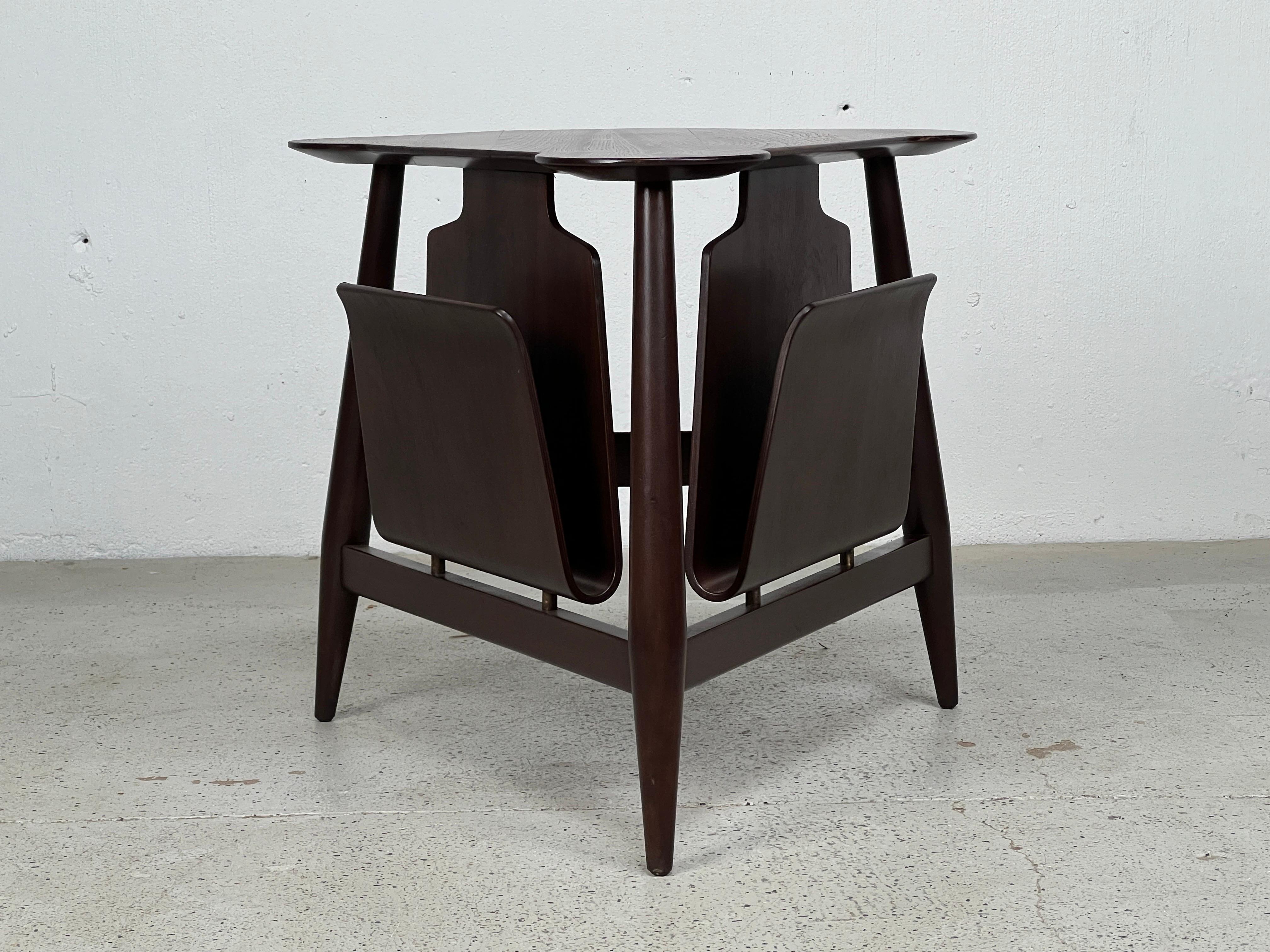 An Edward Wormley for Dunbar magazine table with bentwood holders.