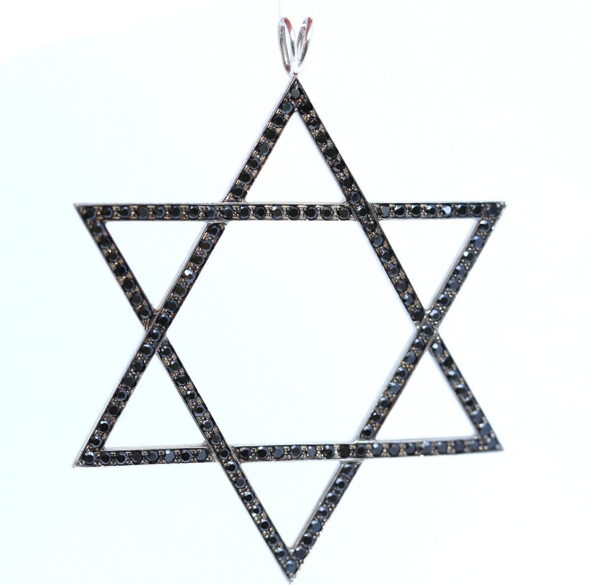 Magen David is an ancient Judaic symbol in it’s modern very clean and stylish interpretation. 18K White Gold with Onyx.
A proud symbol of identity and cool outfit accessory. The chain hole is quite large to accommodate a thick band or ribbon.
Please