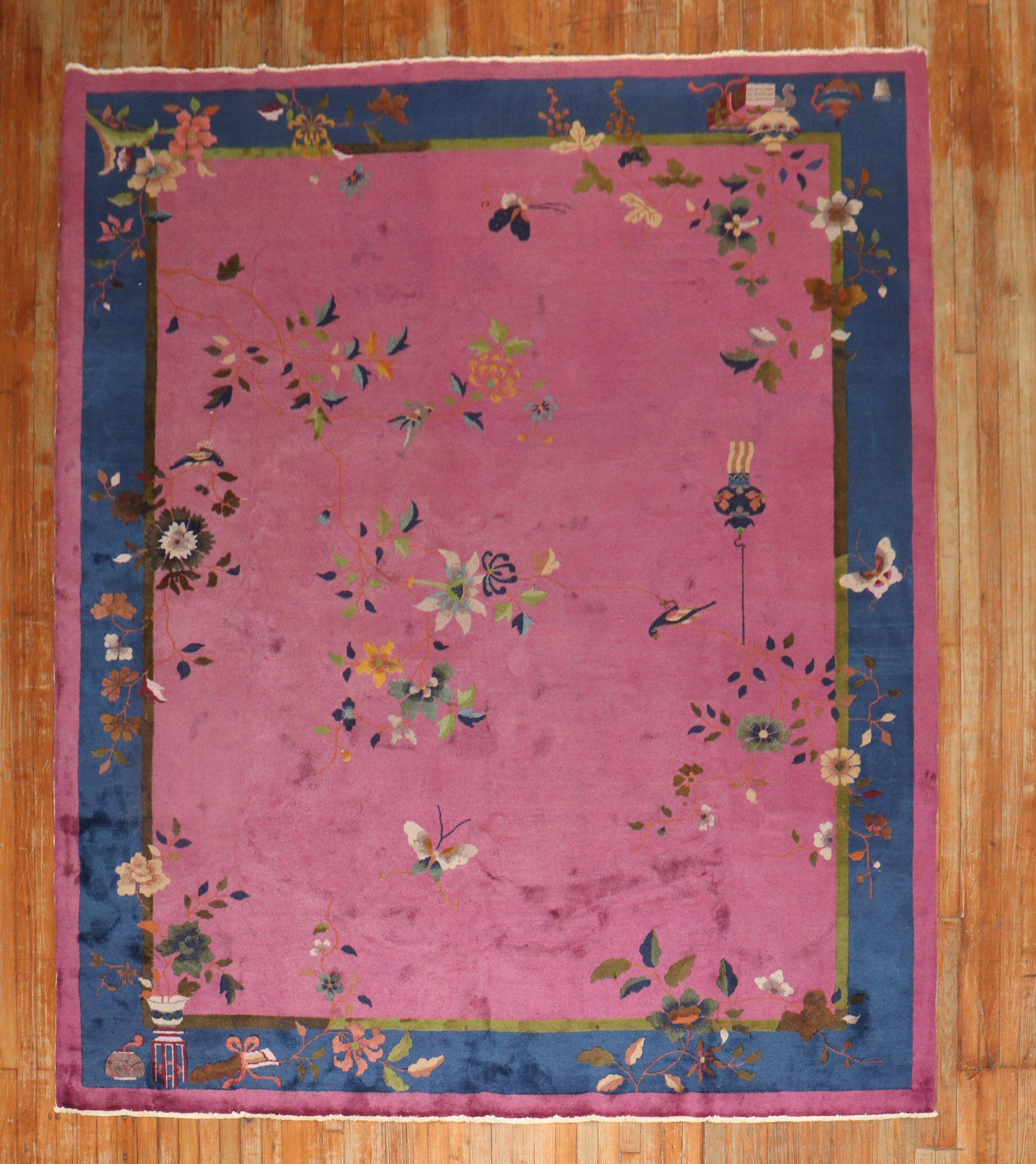 Enchanting early 20th century Chinese Art Deco carpet with a spacious floral design on a Magenta Ground.

Measures: 8' x 9'10''.