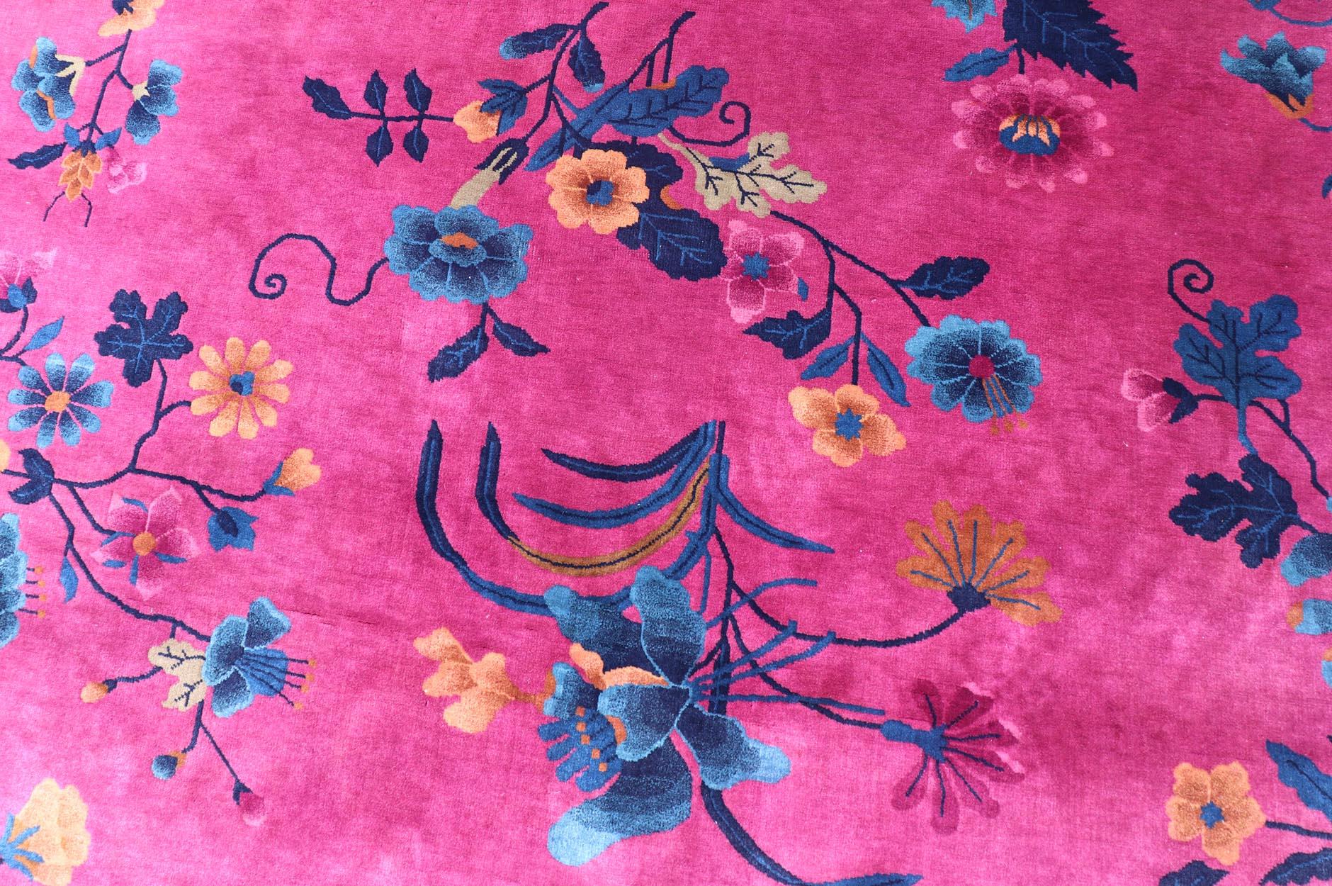 Magenta Background Chinese Art Deco Rug with Large Vining Flowers and Leaves. Keivan Woven Arts / rug X23-0802, country of origin / type: China / Art Deco, circa 1920.
Measures: 12'0 x 14'8 
Alive with color, this beautiful antique Art Deco Chinese
