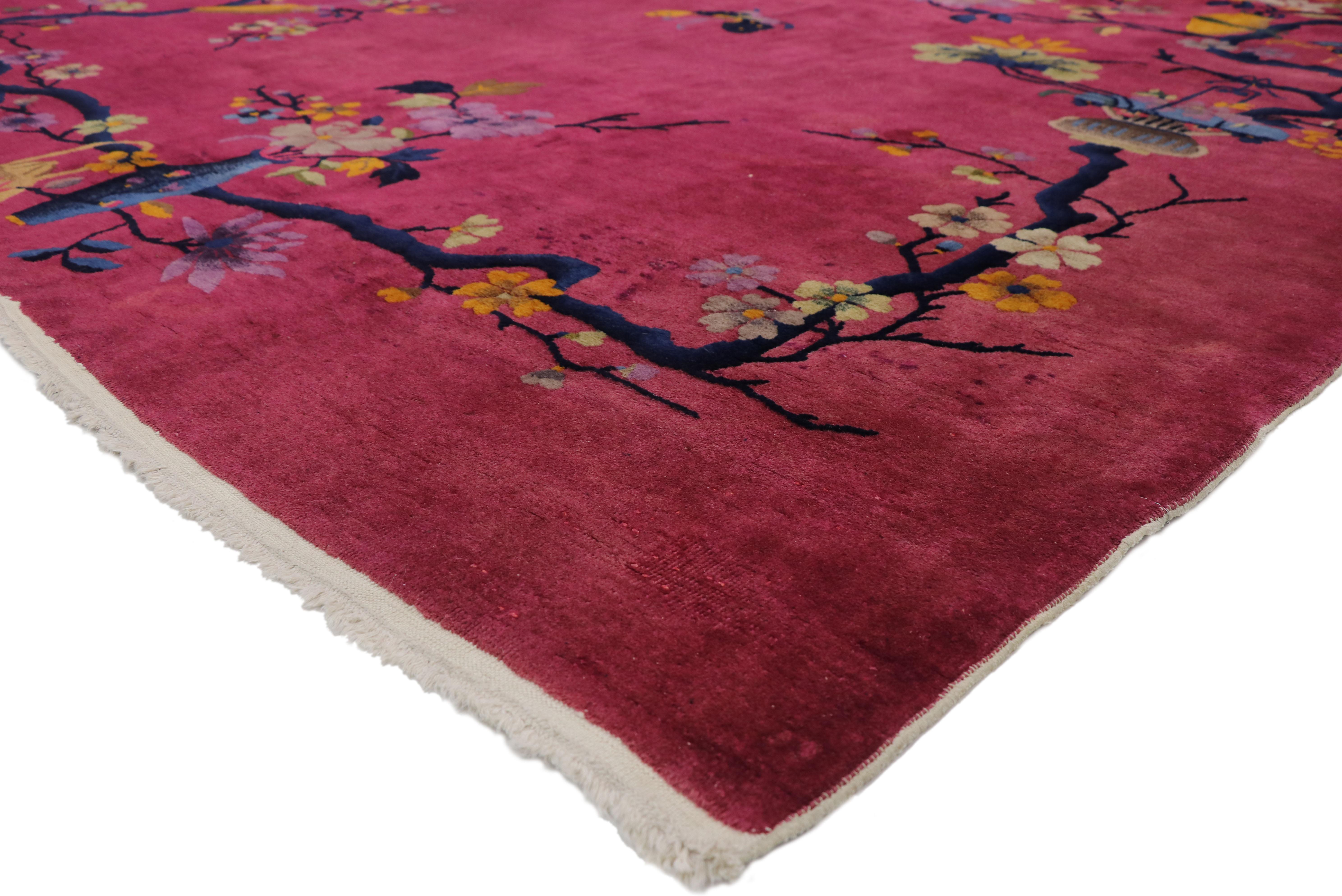 77363, magenta pink antique Chinese Art Deco rug with pictorial chinoiserie design. This hand knotted wool antique Chinese Art Deco rug features a gorgeous pictorial floral garland design overlaid upon an abrashed pink field. A variety of flower