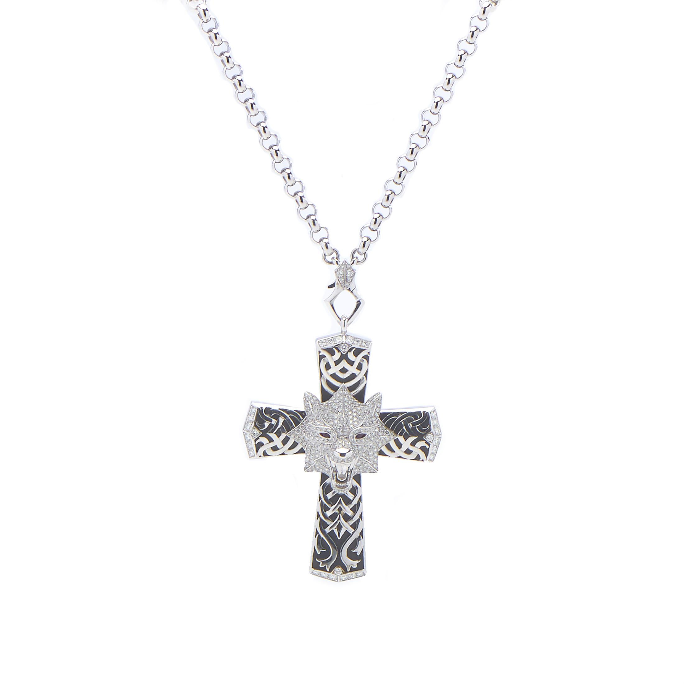 With a mesmerizing pattern where black rhodium-plated and plain bright 18K white gold interplay in a fascinating manner, the majestic cross-shaped pendant of this glorious necklace from Magerit also boasts glittering diamonds amounting to 2.98