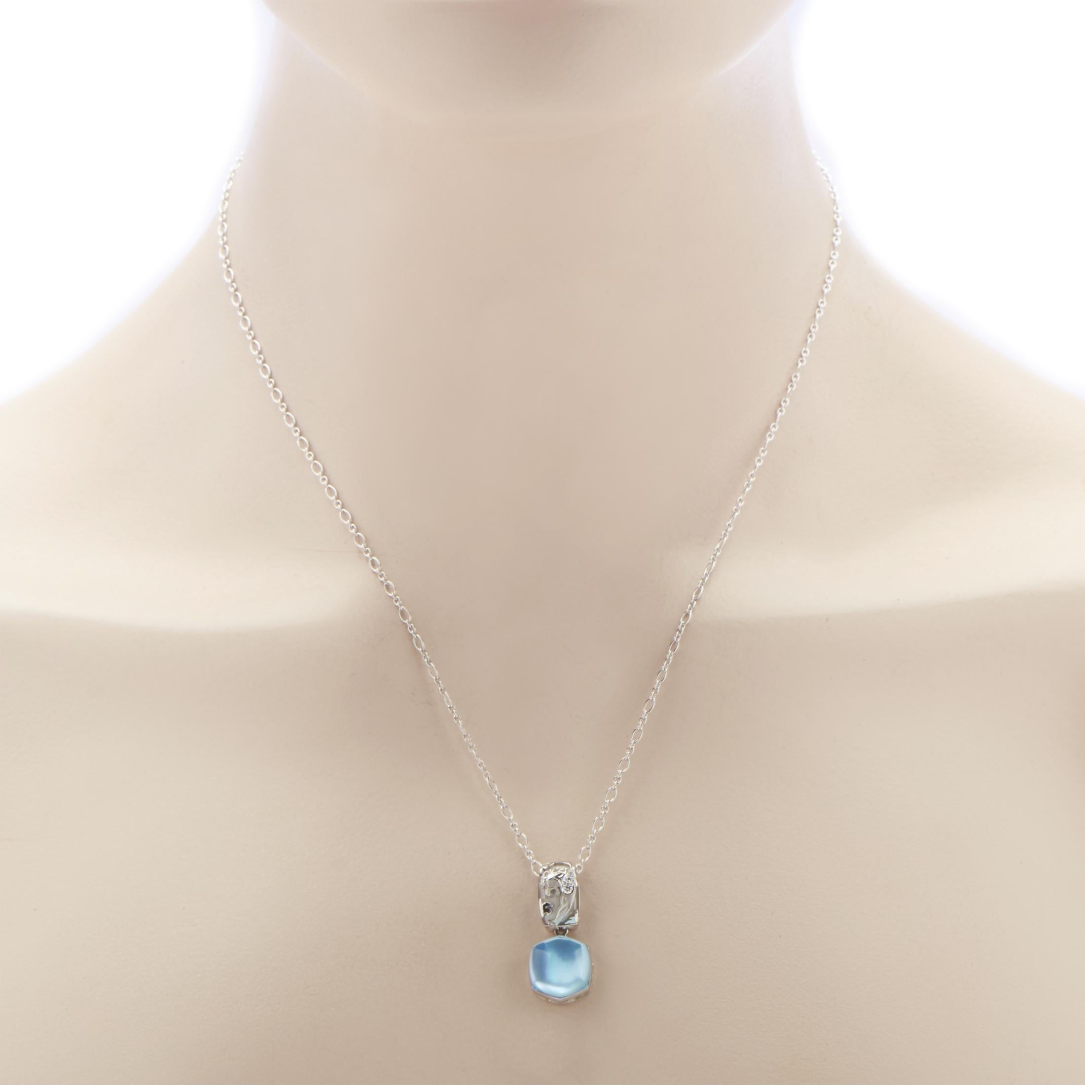 Boasting a pleasantly toned and smoothly shaped topaz stone weighing 8.95 carats upon mother of pearl that tastefully complements the bright blend of prestigious 18K white gold and lustrous diamonds totaling 0.09ct, this charming necklace from