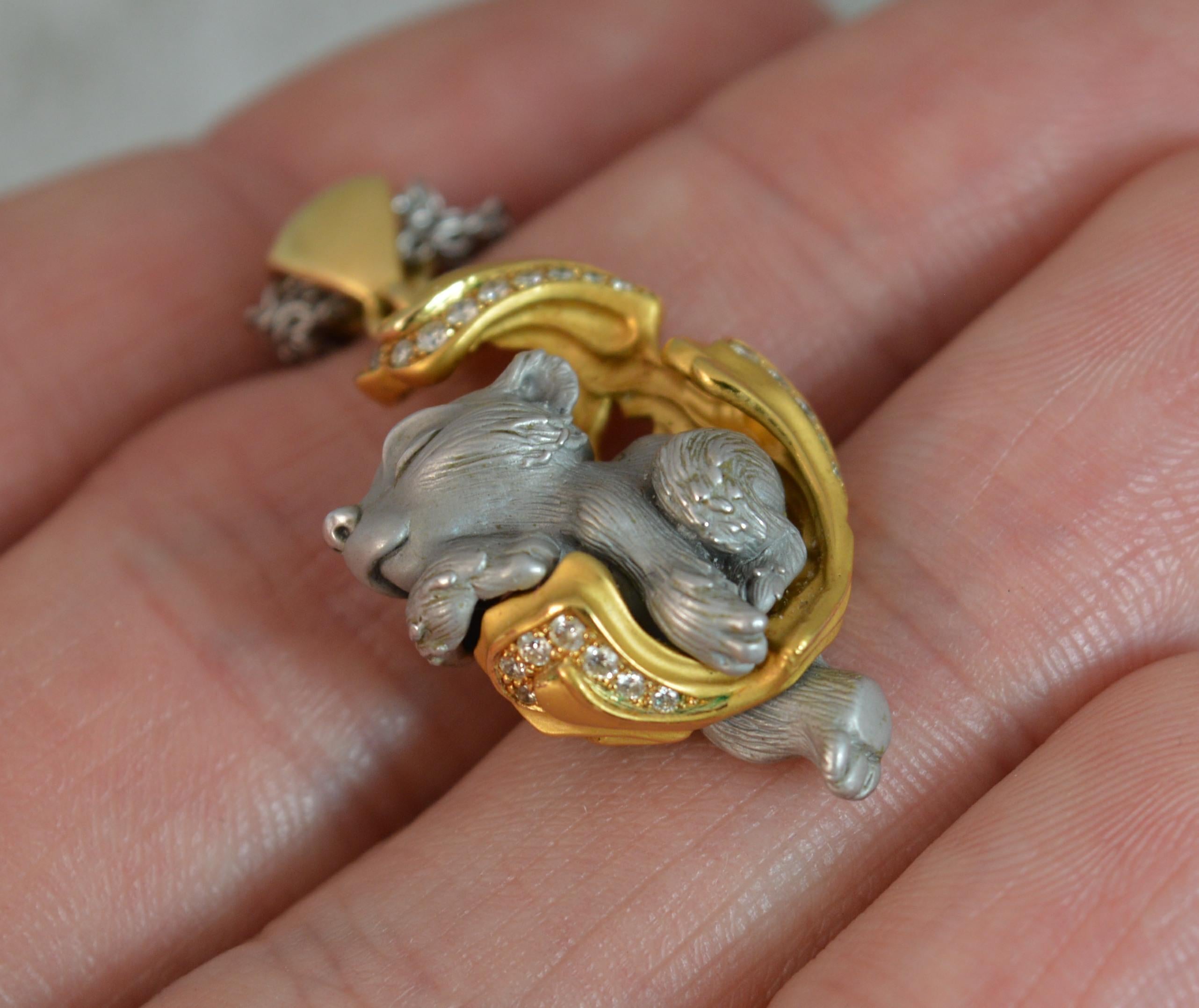 A stunning quality Magerit Dreams designer pendant and chain.

The pendant is exquisitely made in 18 carat yellow and white gold with both a shiny and matte finish. Formed depicting a sleeping bear with round brilliant cut diamonds to the yellow