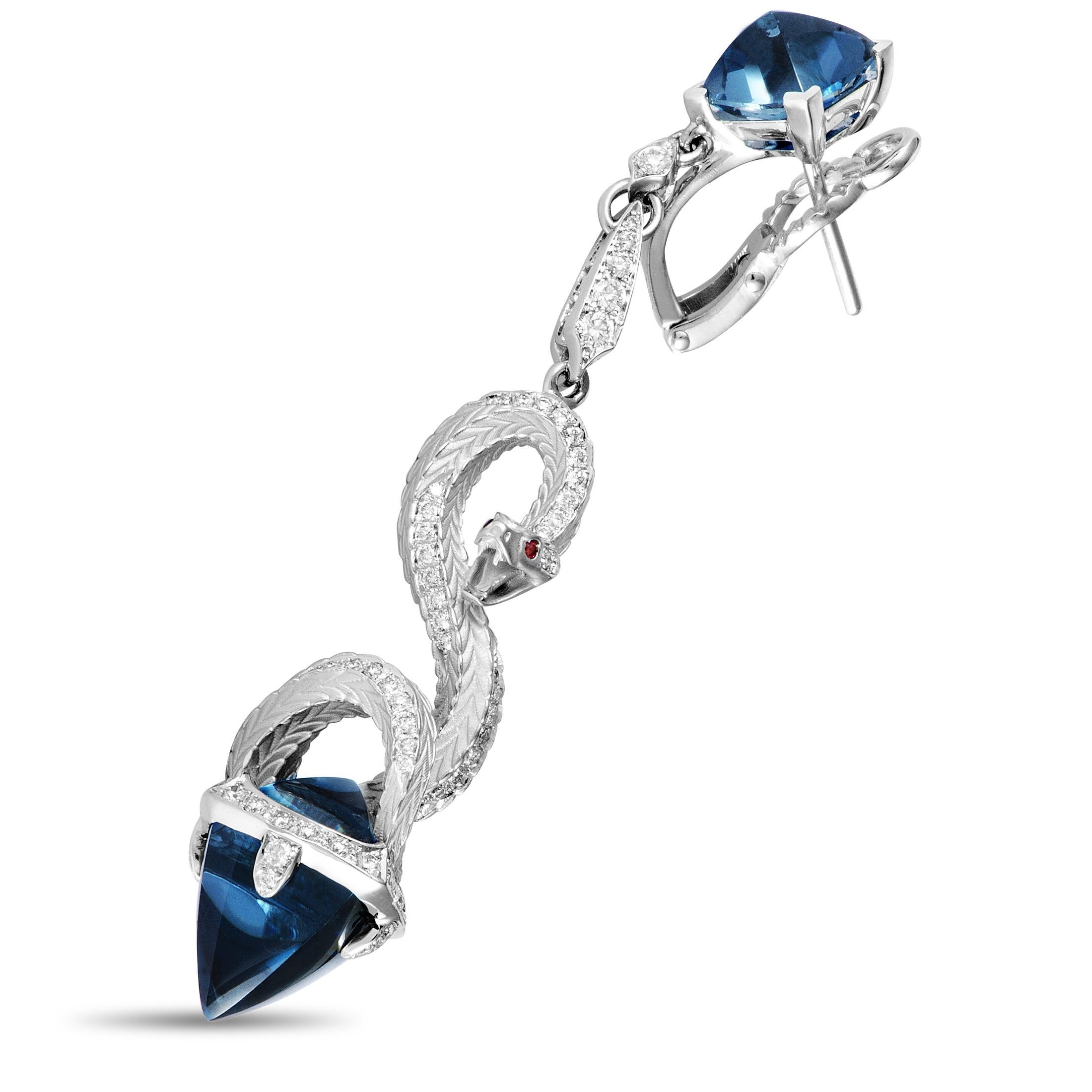 The elegant sheen of 18K white gold is brought out magnificently by the stunning London topaz in these exquisite Magerit earrings from the fascinating “Mythology” collection. The earrings are also decorated with scintillating diamonds and striking