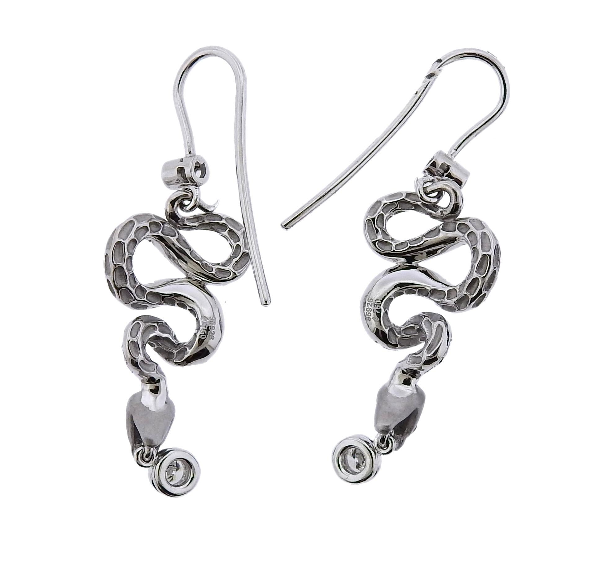 Brand new pair of 18k white gold snake earrings by Magerit, set with approx. 0.82ctw in G/VS diamonds.  Retail $7400. Comes with box and COA.  
 Earrings measure 45mm x 14mm. Weight: 9.7 grams.Marked:  95926, 750, Maker's mark.