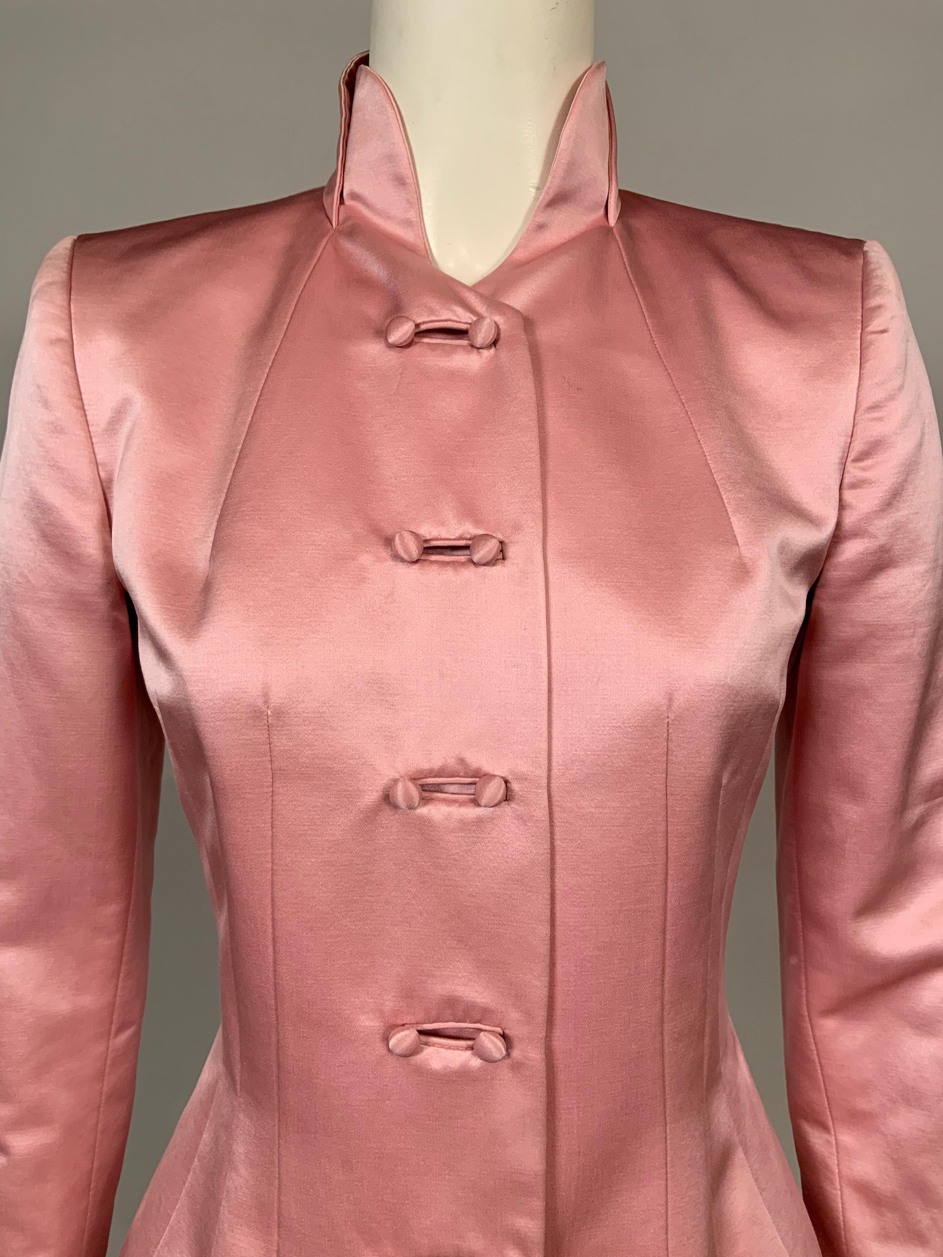 Pretty in Pink! This jacket is the most flattering shade of pink silk satin. It has a Mandarin style collar, a double set of buttons at the center front, deep cuffs with five decorative buttons and a beautifully fitted waistline with a series of