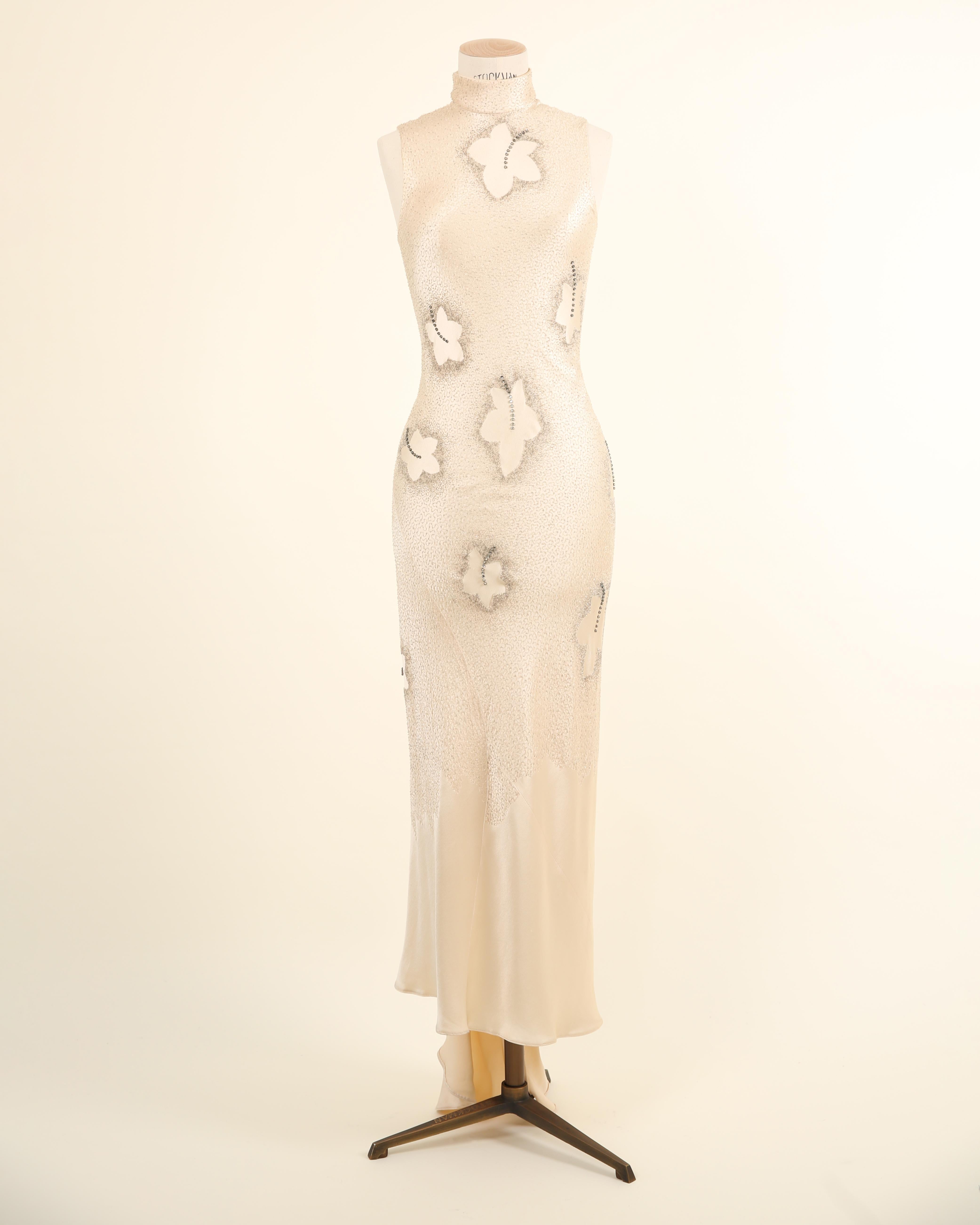 LOVE LALI VINTAGE

An exquisite and very rare vintage couture dress by Maggie Norris that would have been specially made to order. Oriental style, the dress is composed of a very pale champagne coloured silk, cut on the bias to streamline the body,