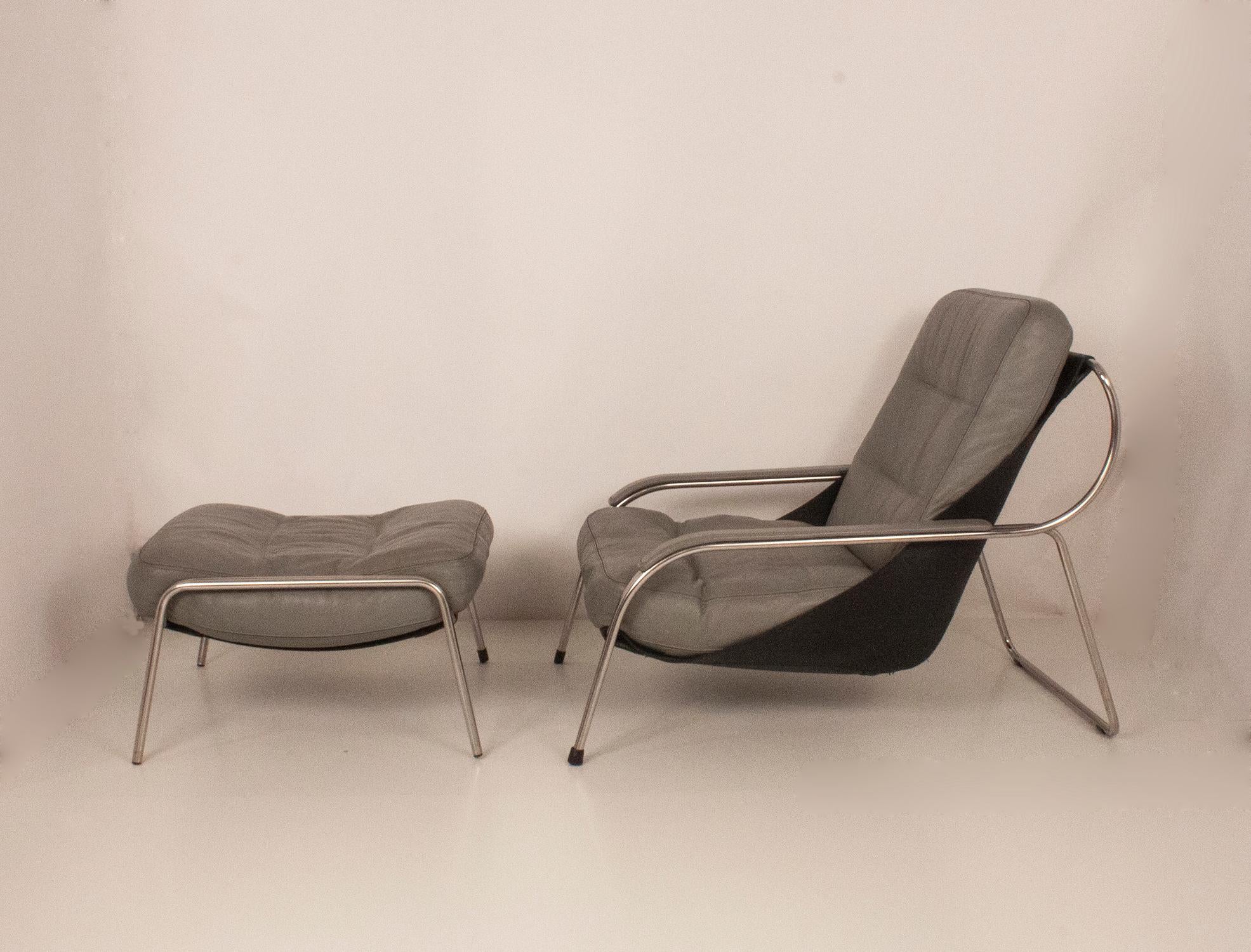 Maggiolina chair and ottoman by Zanotta designed by Marco Zanuso, 1947. Cowhide sling supports leather cushions. Stainless steel frame supports this very comfortable and sleek lounger! Ottoman. Color Gray