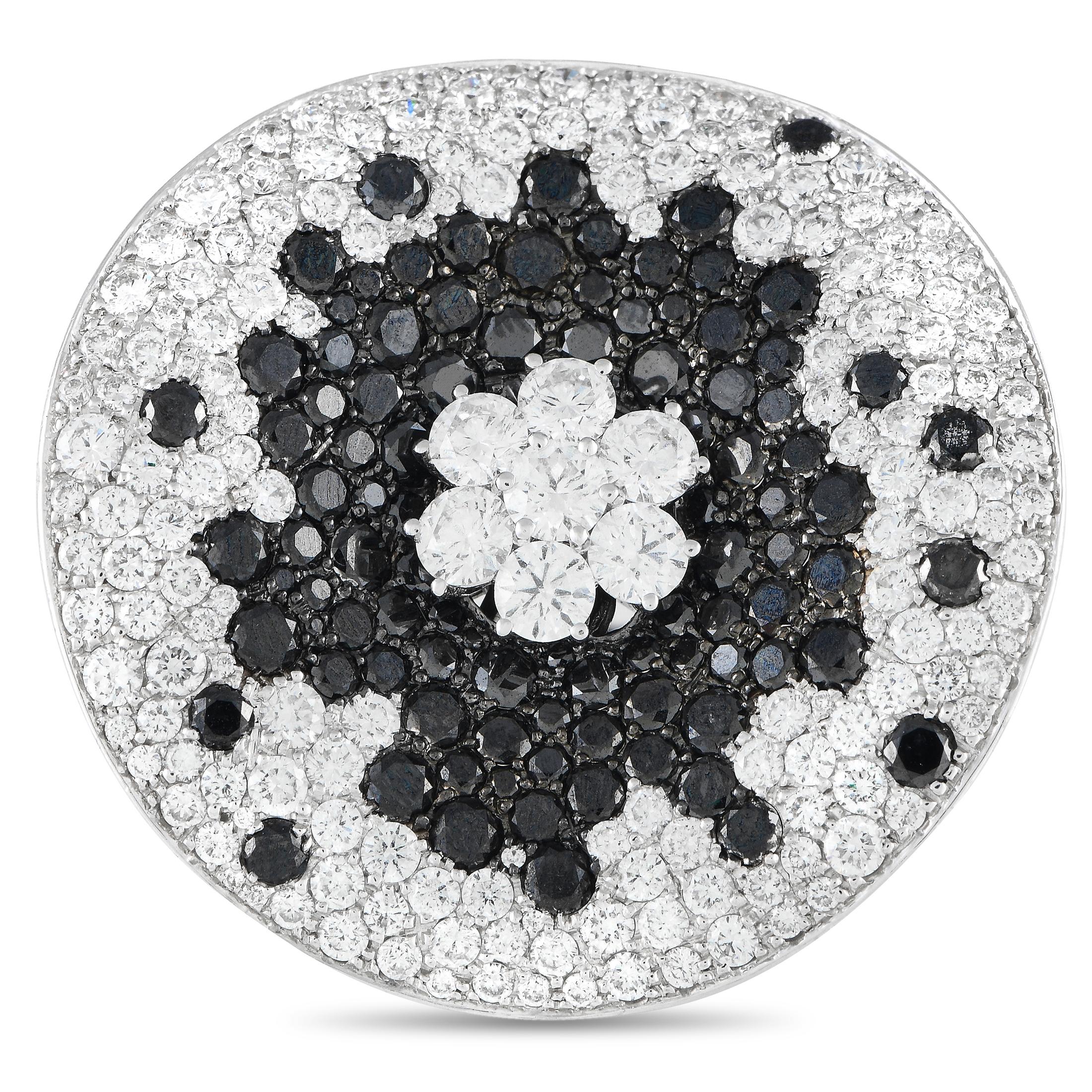 This delightful display ushers in visions of summer with a divine blend of white and black diamonds. 4.69ct white diamonds are given sharp contrast against sprinklings of 11.88ct black diamonds across the thin wafer of 18K white gold.