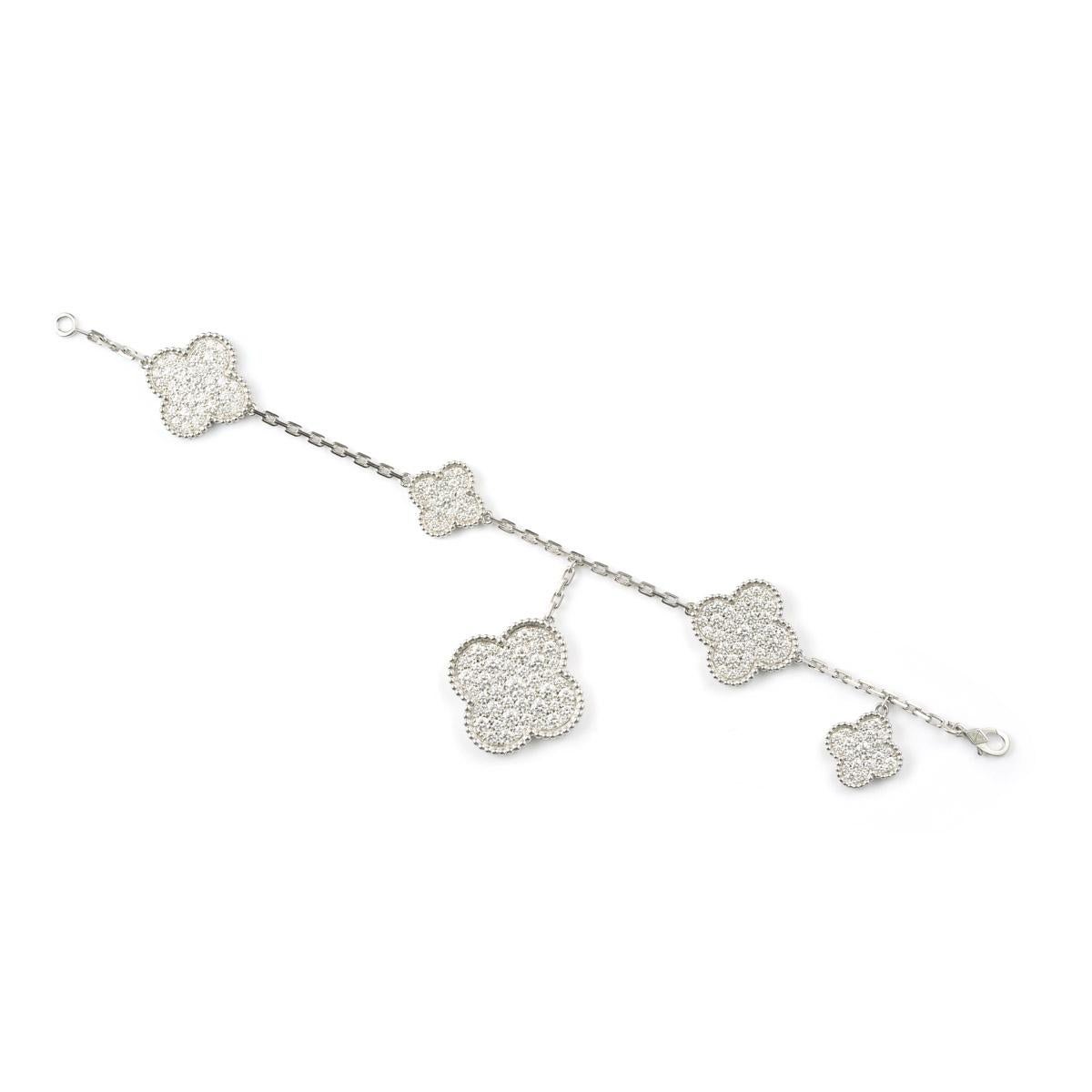 Magic Alhambra bracelet, 5 motifs, rhodium plated 18K white gold, round diamonds; diamond quality DEF, IF to VVS.
Diamond: 161 stones, 5.64 carats
Hallmark clasp, small model in 18K white gold
Bracelet wrist size: 7.48 inches
