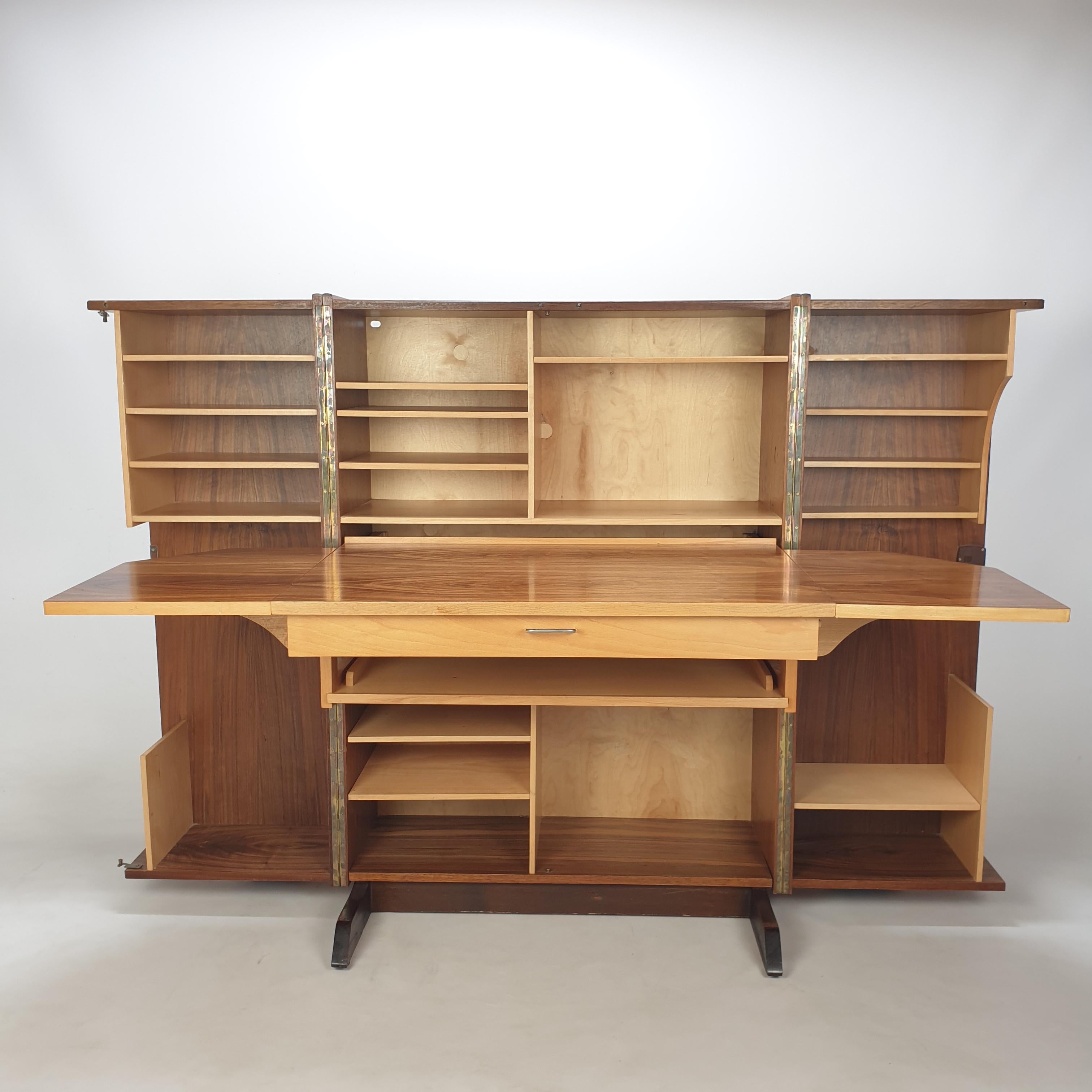 This absolute phenomenal writing desk, was designed by Mummenthaler and Meier (Switzerland) in the 60's. 
It is a foldable and closable writing desk or secretary desk called the 