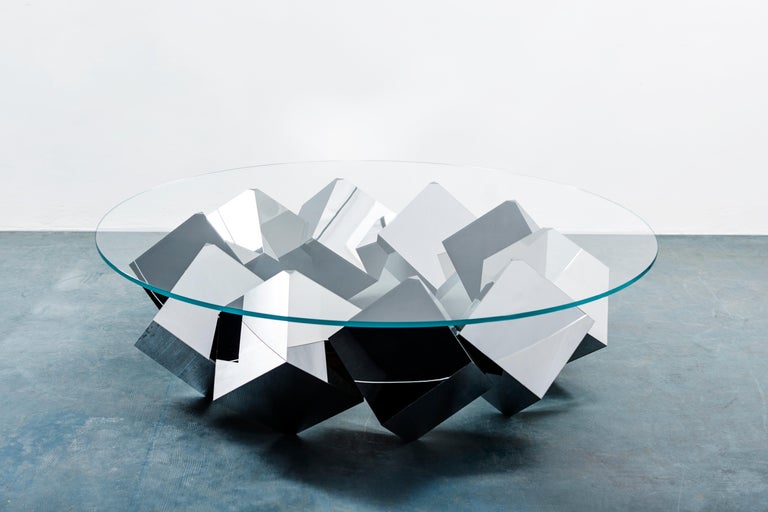 For this coffee table, Chris Duffy attempts to give the impression of continuous motion, although the table is stationary it has a zoetropic feeling, like Sisyphus rolling a boulder in an infinite circle.

Part of Duffy London's Megalith series,