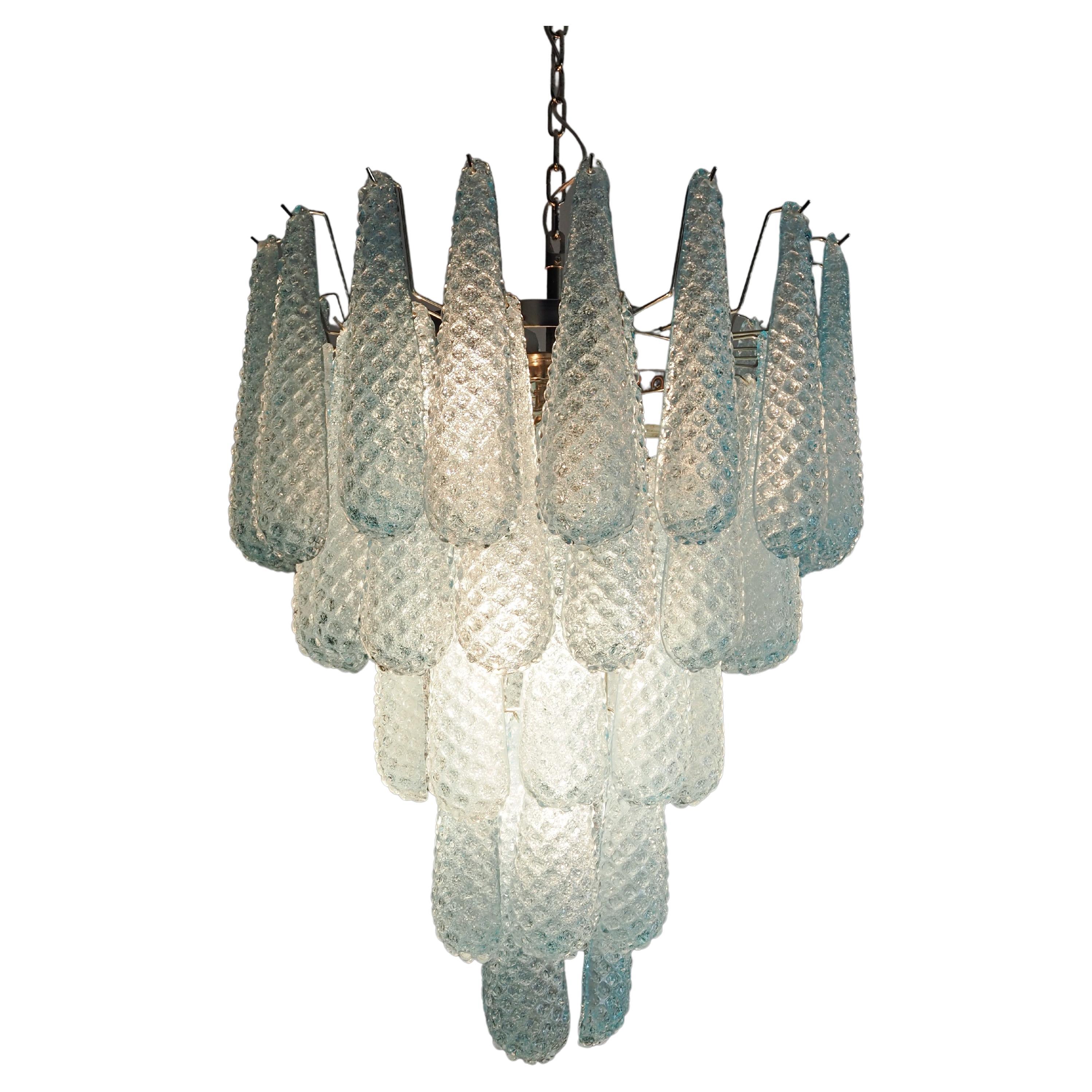 Huge Italian vintage Murano chandelier made by 52 glass petals (BLUE crystal, smooth outside, with crystal powder and then rough inside.) in a chrome frame.
Period: late XX century
Dimensions: 55,10 inches (140 cm) height with chain; 29,50 inches