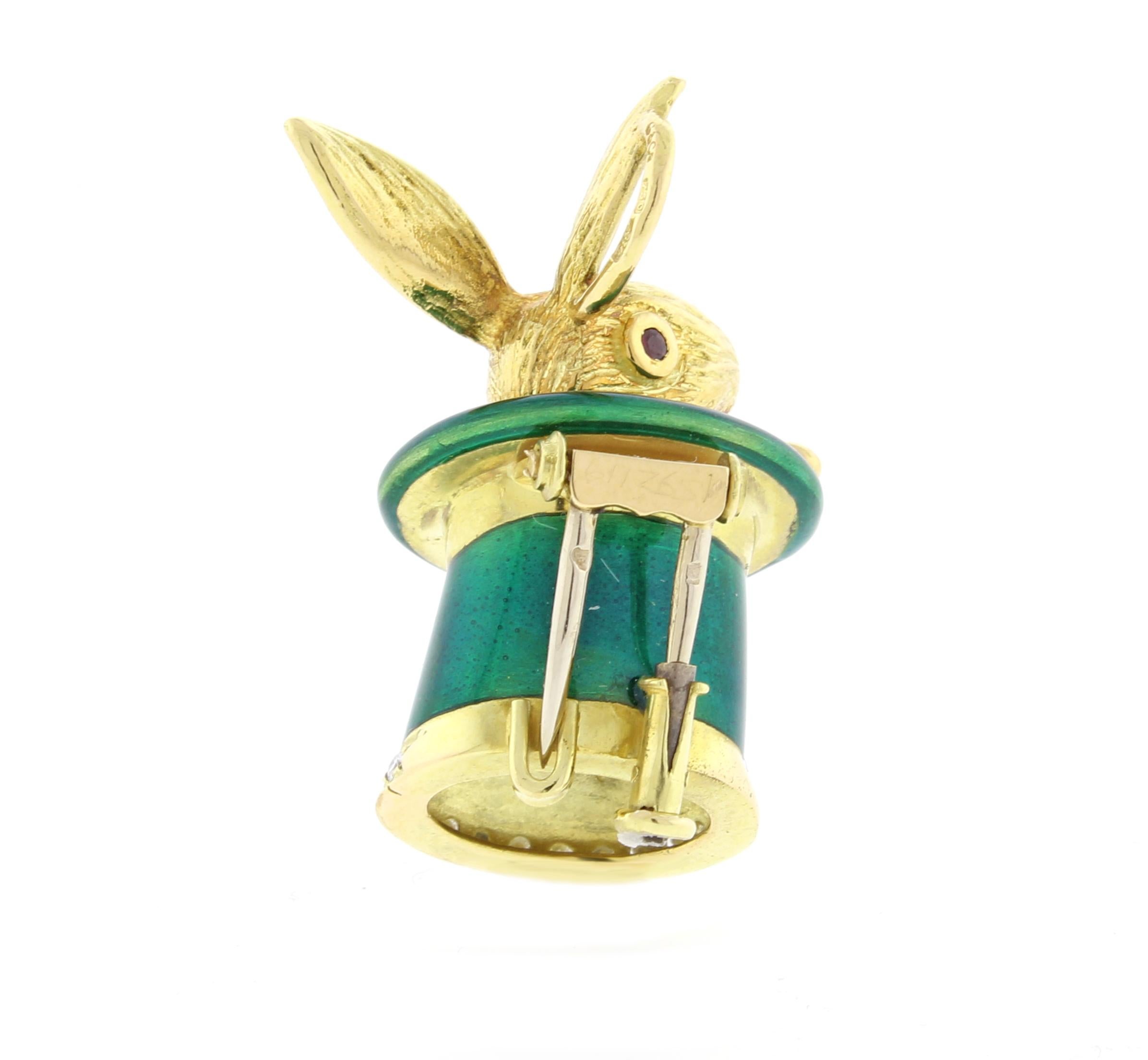  A golden rabbit pops his head from a green enamel and diamond hat in this French made pendant brooch
♦ 18 karat
♦  Diamonds =..10
♦ Circa 1995
♦ Weight 23.5 grams
♦ Dimensions: 1¼1 X 11¾ 
♦ Condition: Excellent , pre-owned
