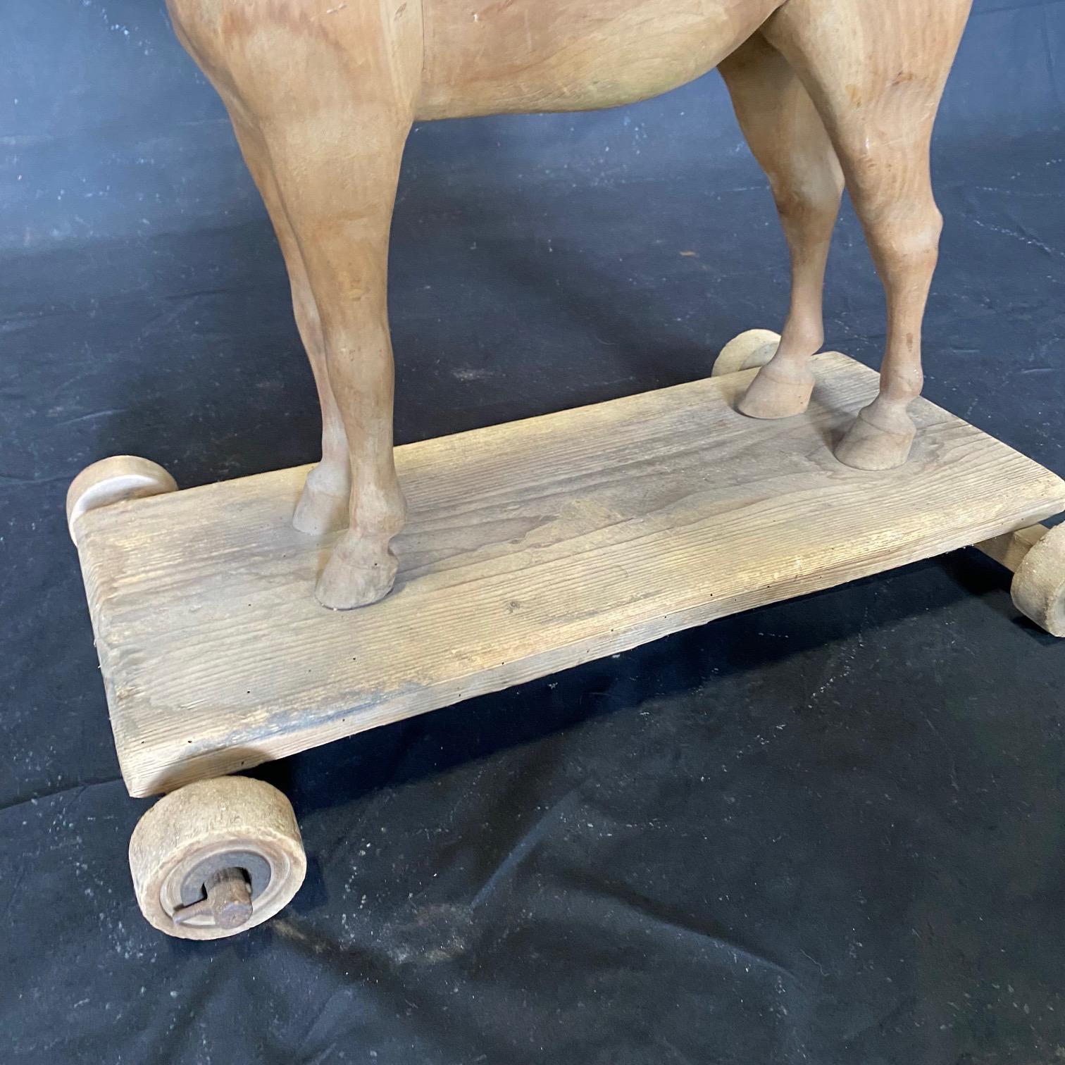 Magical Large 19th Century French Beautifully Carved Wooden Horse Pull Toy In Good Condition For Sale In Hopewell, NJ