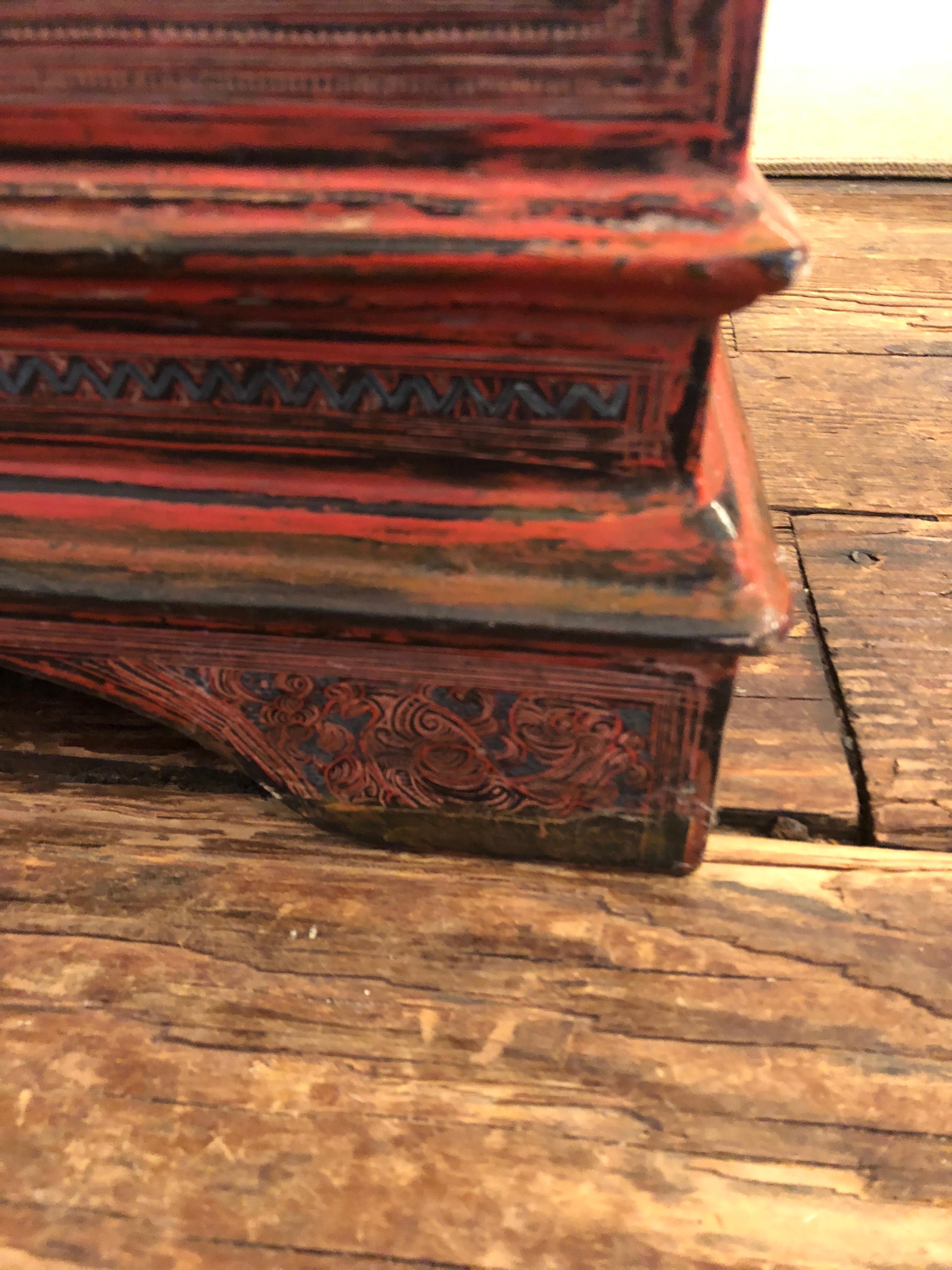 If objects could talk, this box would have some interesting stories for all its wonderful aged patina, cracks and character. A faded cinnabar, the entire surface is meticulously hand painted, and inside there's a fitted top compartment that lifts
