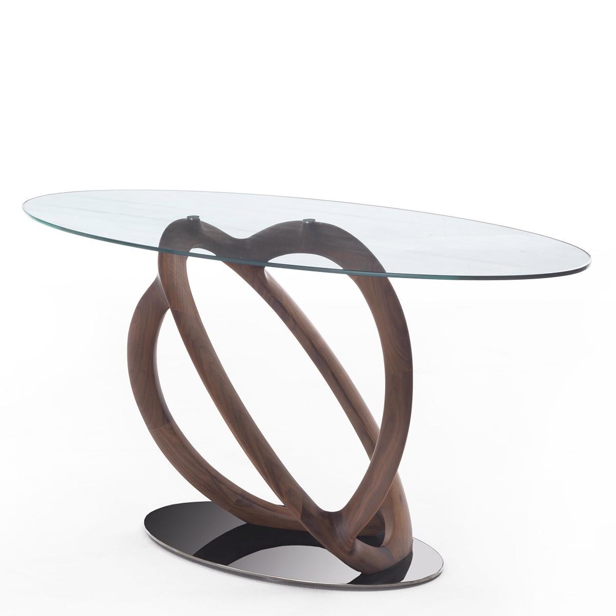 Console table magical walnut with solid hand-carved 
walnut base on chrome steel base plate. With tempered 
clear glass oval top, 10mm thickness.
 