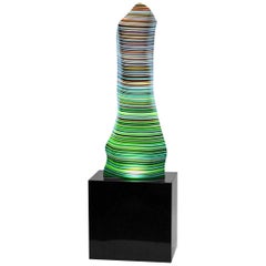 Magikarpet - Lampe linéaire en verre de code-barres vert chaud sur base en granit noir