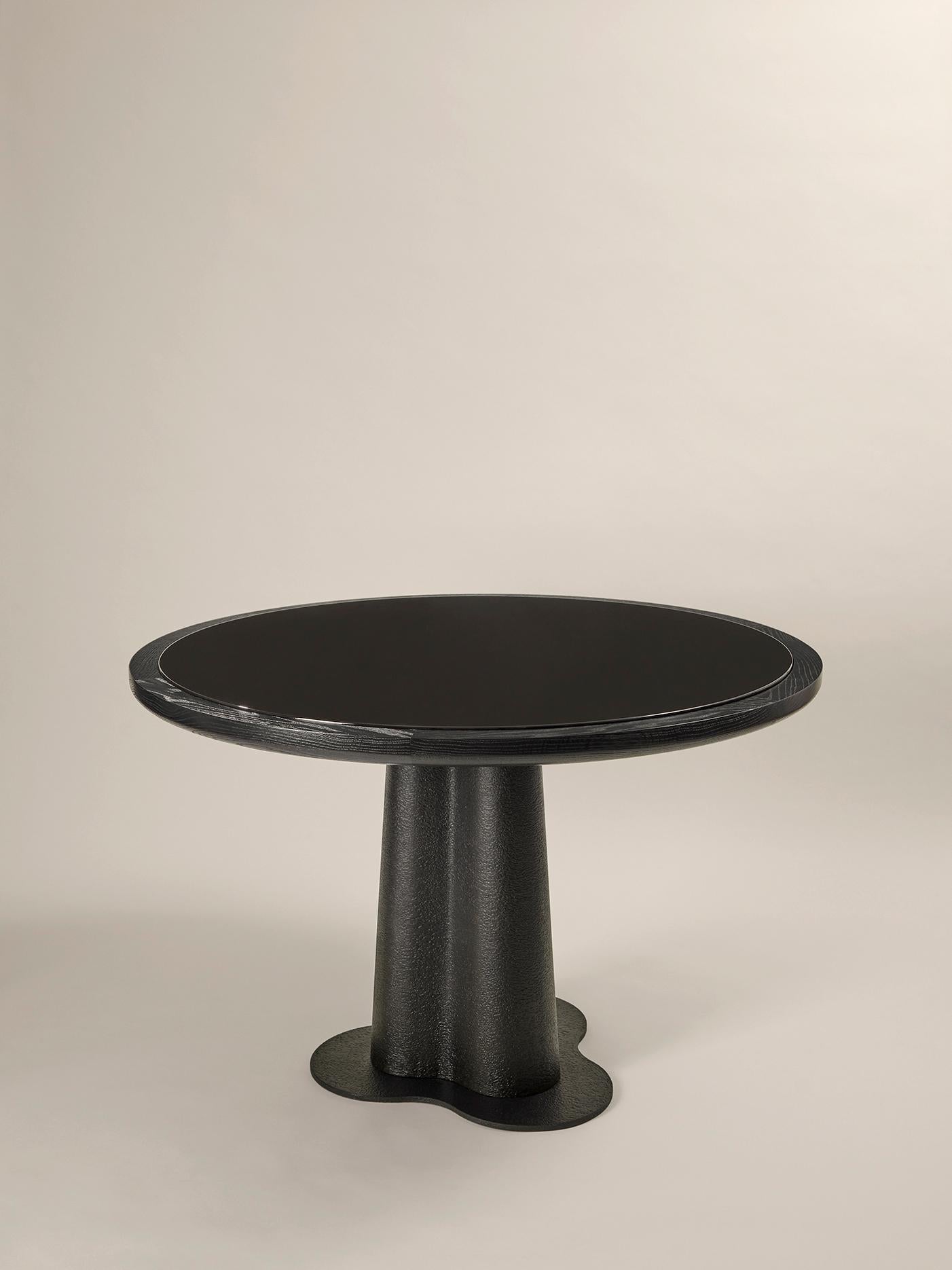 Magma dining table
Top in a natural brushed, black or white oak or pine with a tray in black or white
emailed lava stone.
Feet in metallisation tainted in black
Base in metallisation tainted in black

Dimension (cm) : Ø 120 x H 73

Evoking both