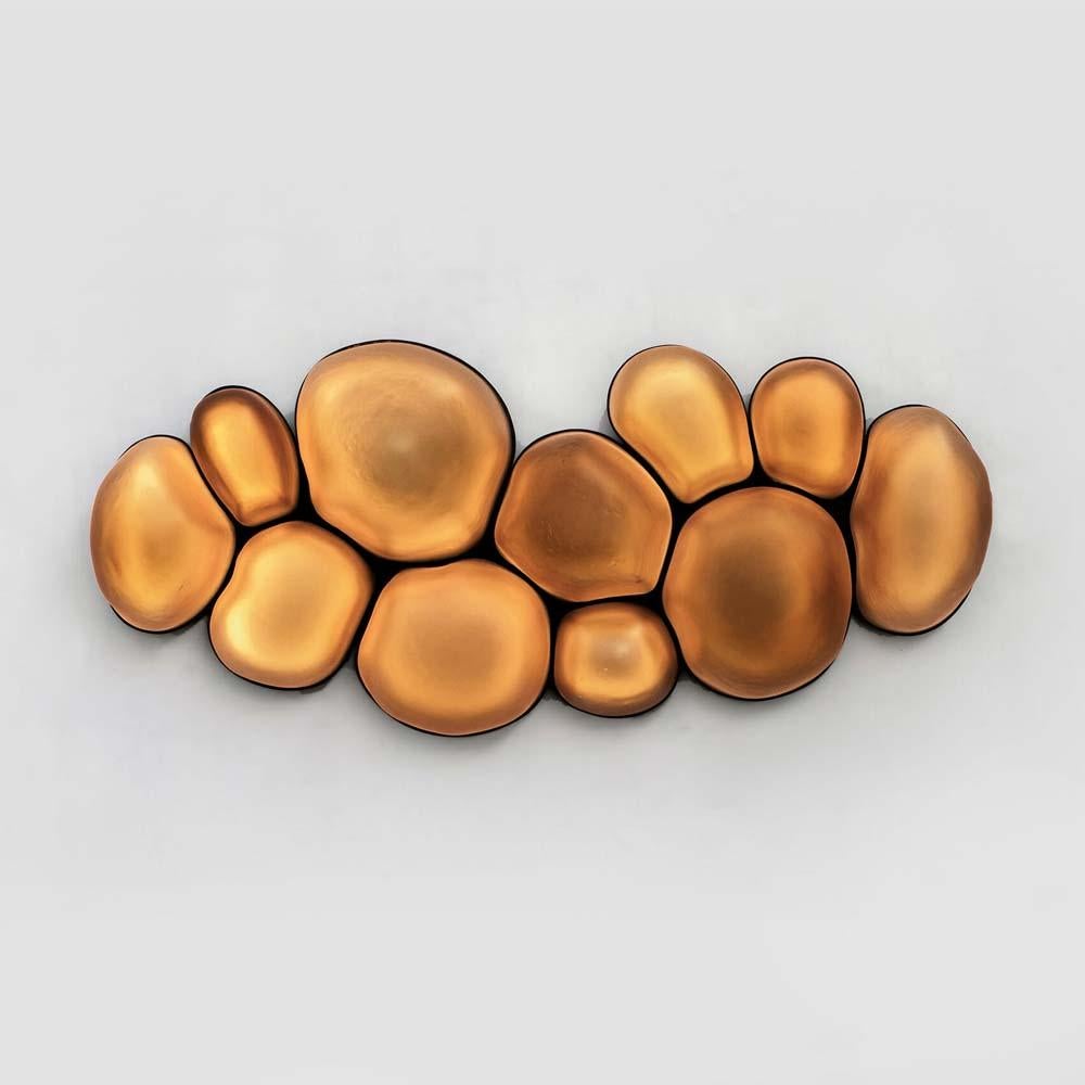 A large wall lamp from the Special Golden Edition for Curio/Design Miami, Basel.

Manuel Bañó & Héctor Esrawe collaborated with Nouvel Limited to produce the special golden edition of Magma lighting sculptures for Curio/ Design Miami, Basel. The