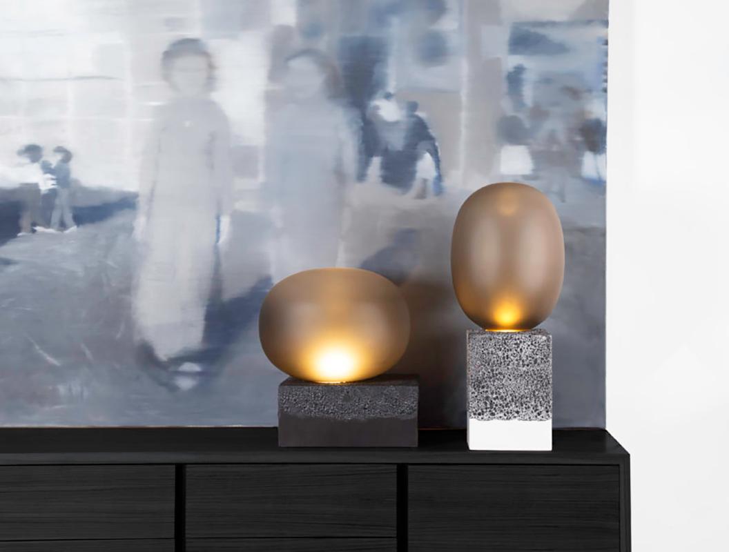 Magma one high, European, Minimalist, smoky grey acetato, Black Base, German, lighting design, 1920s

Notable design always mirrors rationality and emotion”, says Ferréol Babin. Magma displays the production of the origins of glass and the