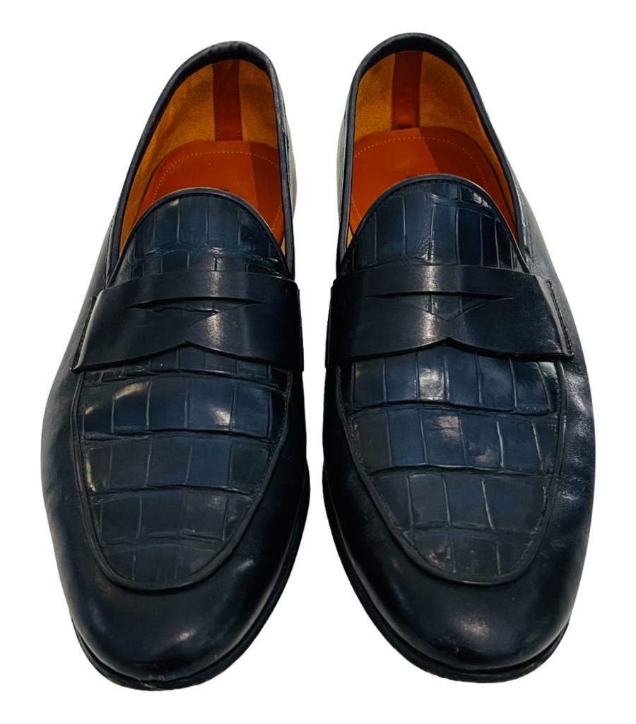Magnanni Croc Embossed Leather Loafers

Black shoes with blue undertone crafted in smooth grain calf leather and designed with croc embossed detail.

Featuring almond toe, penny slot and low stacked heel. Rrp £513

Size – 41

Condition – Good